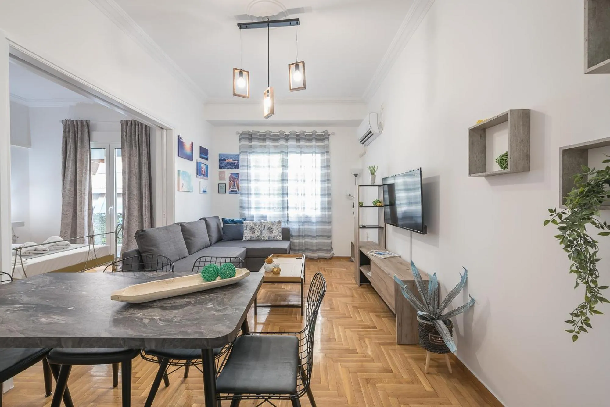 Living room in Athens Bright Suite by CloudKeys