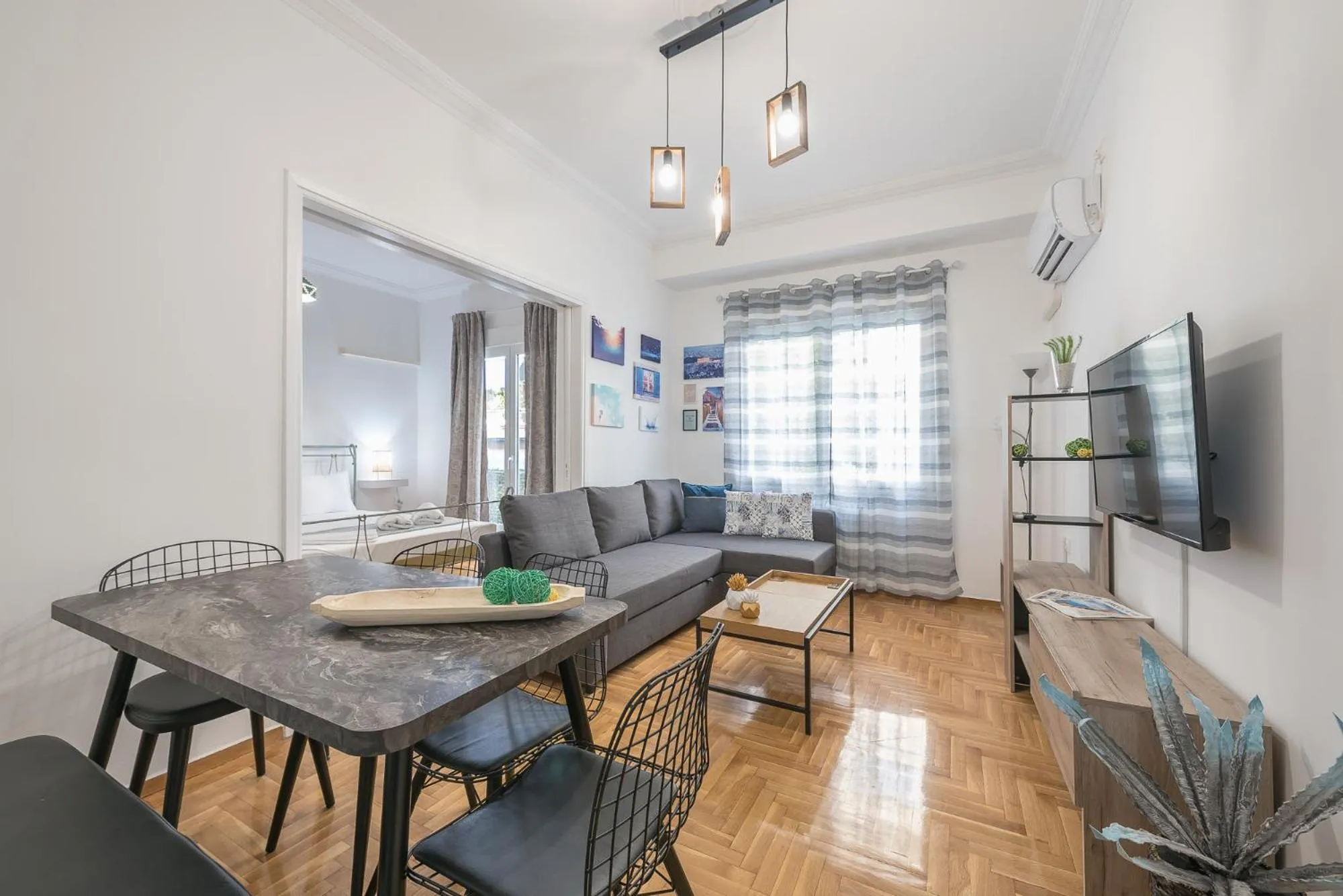 Living room in Athens Bright Suite by CloudKeys