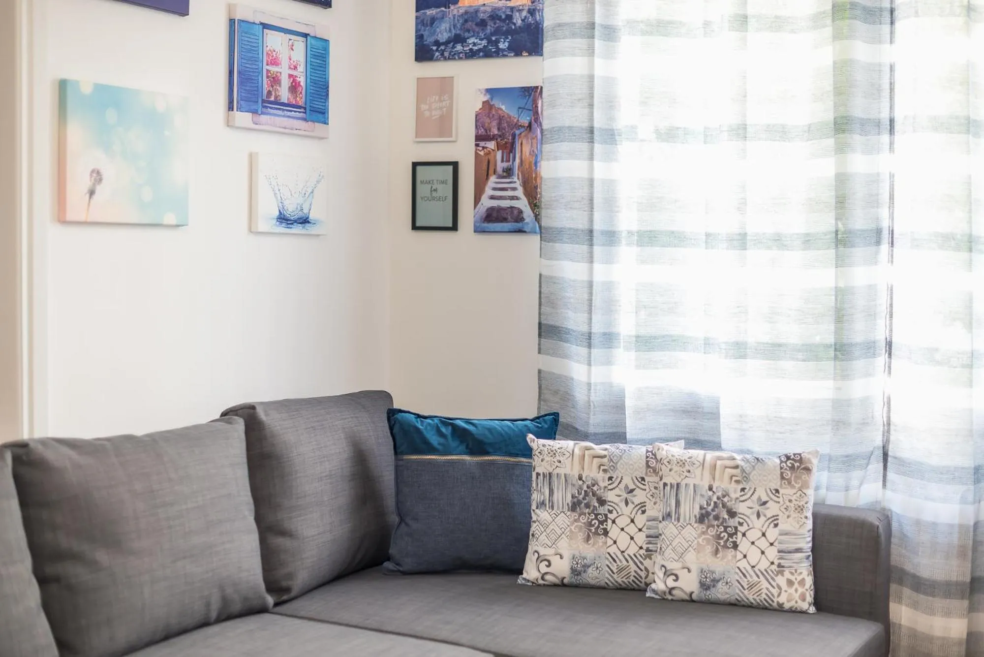 Living room in Athens Bright Suite by CloudKeys