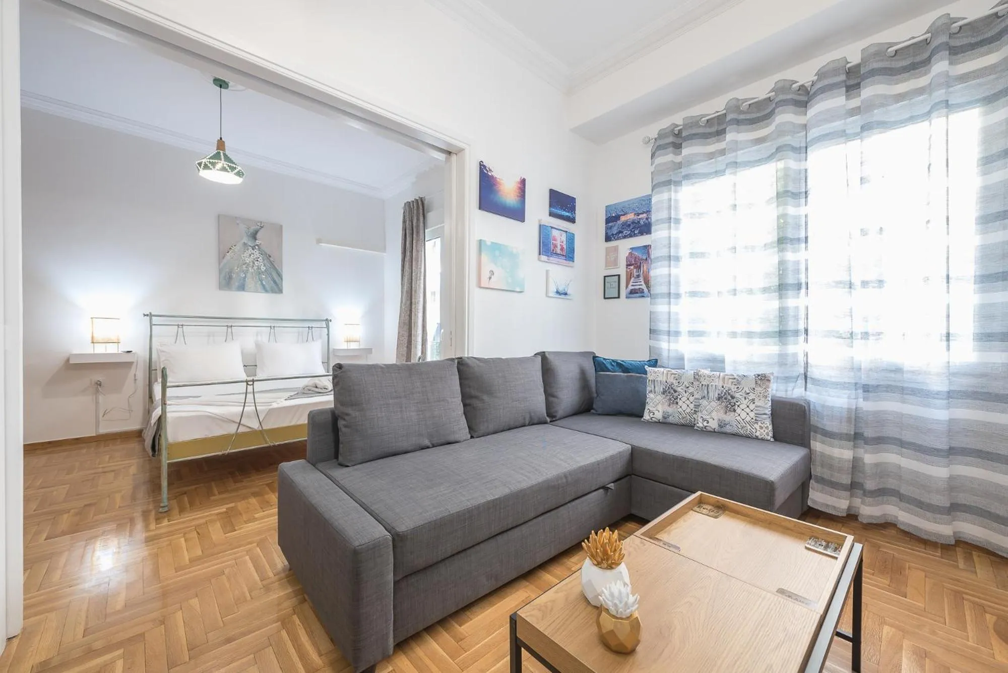 Living room in Athens Bright Suite by CloudKeys