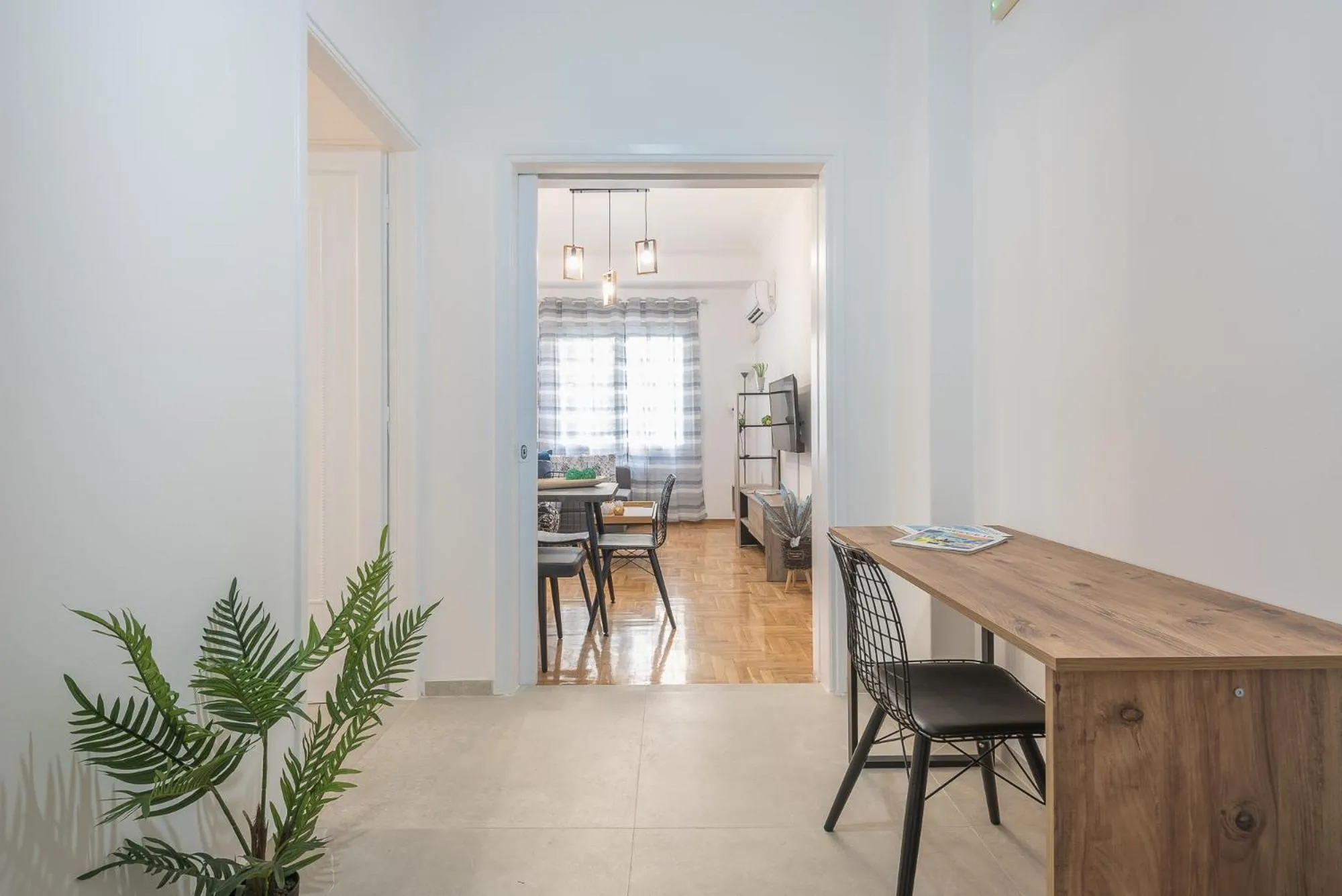 Living room in Athens Bright Suite by CloudKeys