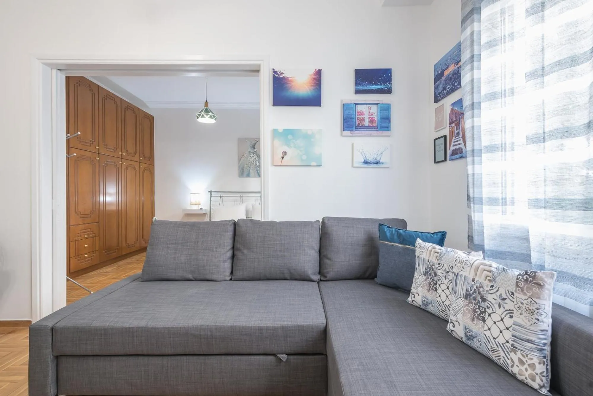 Living room in Athens Bright Suite by CloudKeys