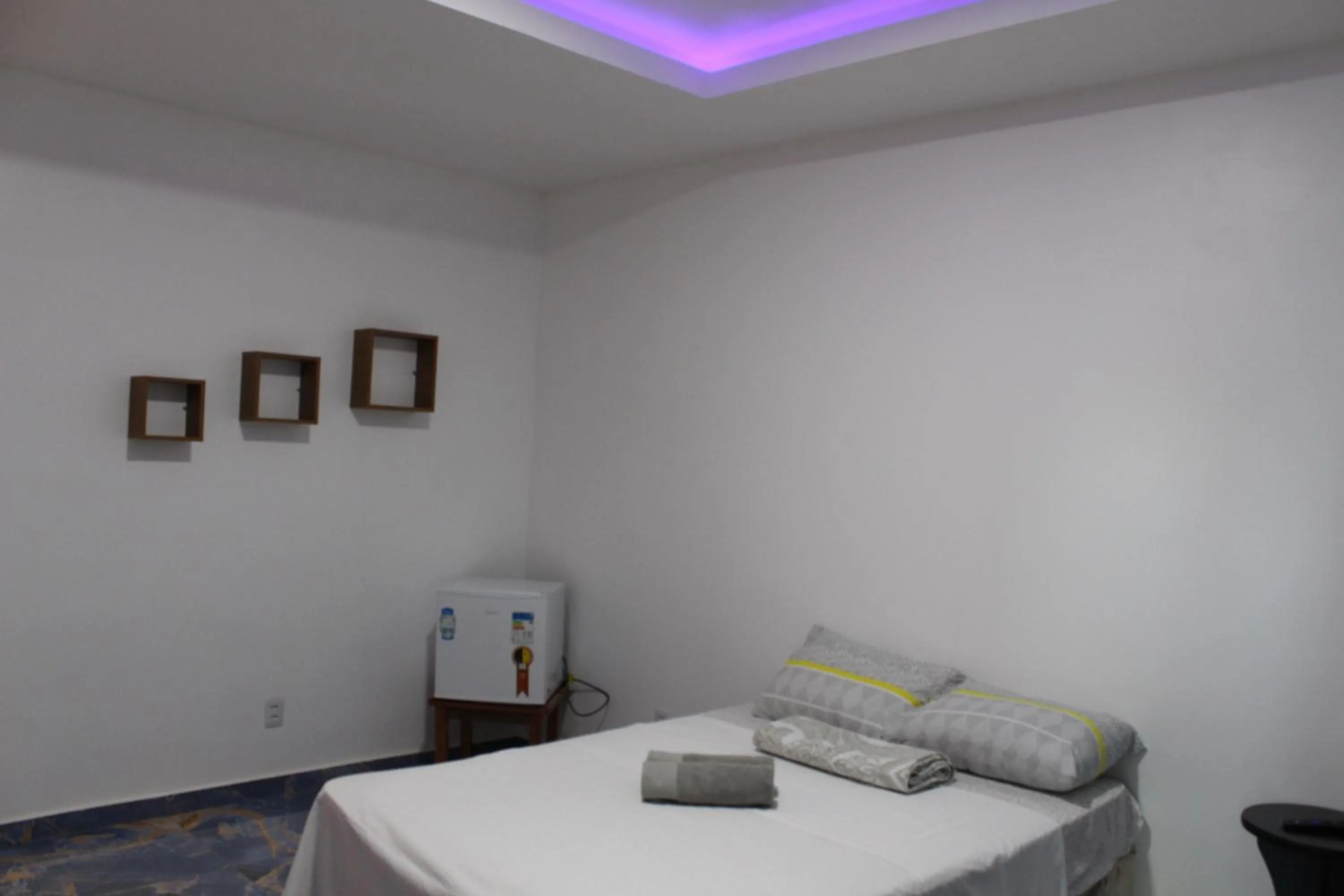 Bed in Hotel Jardim Tropical