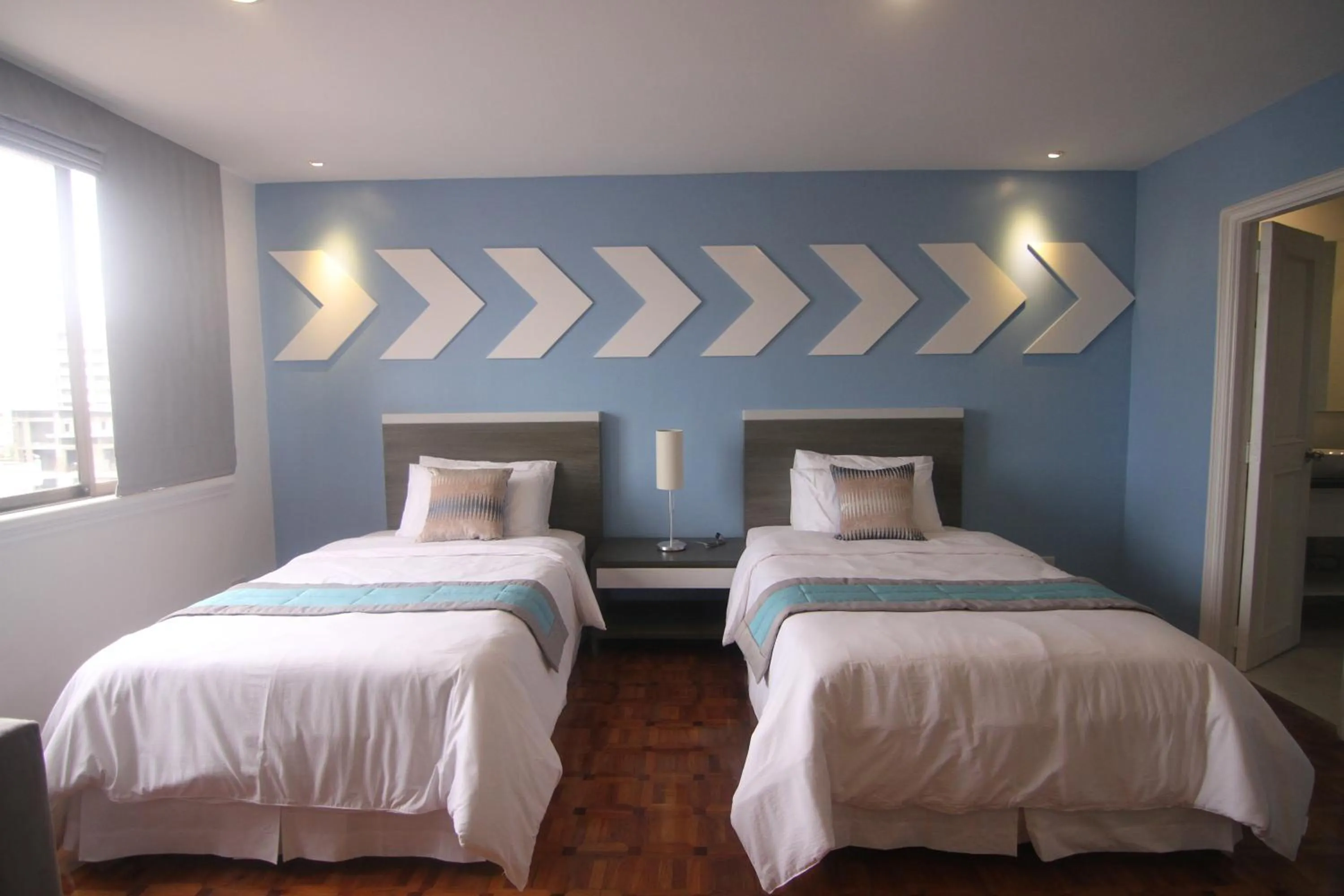 Bed in Bryan Condo Suites Makati near Airport