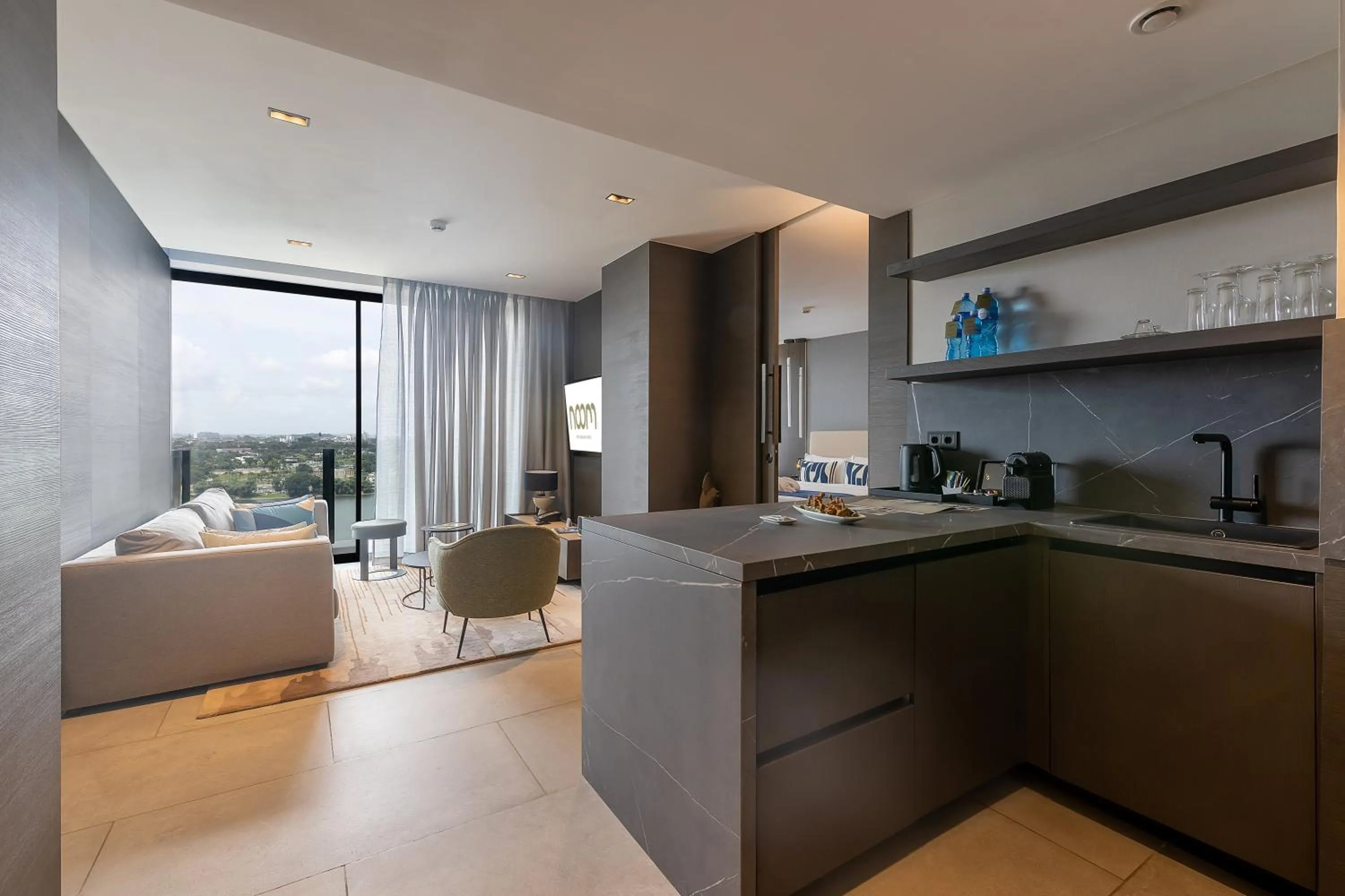 Communal lounge/ TV room in Noom Hotel Abidjan Plateau