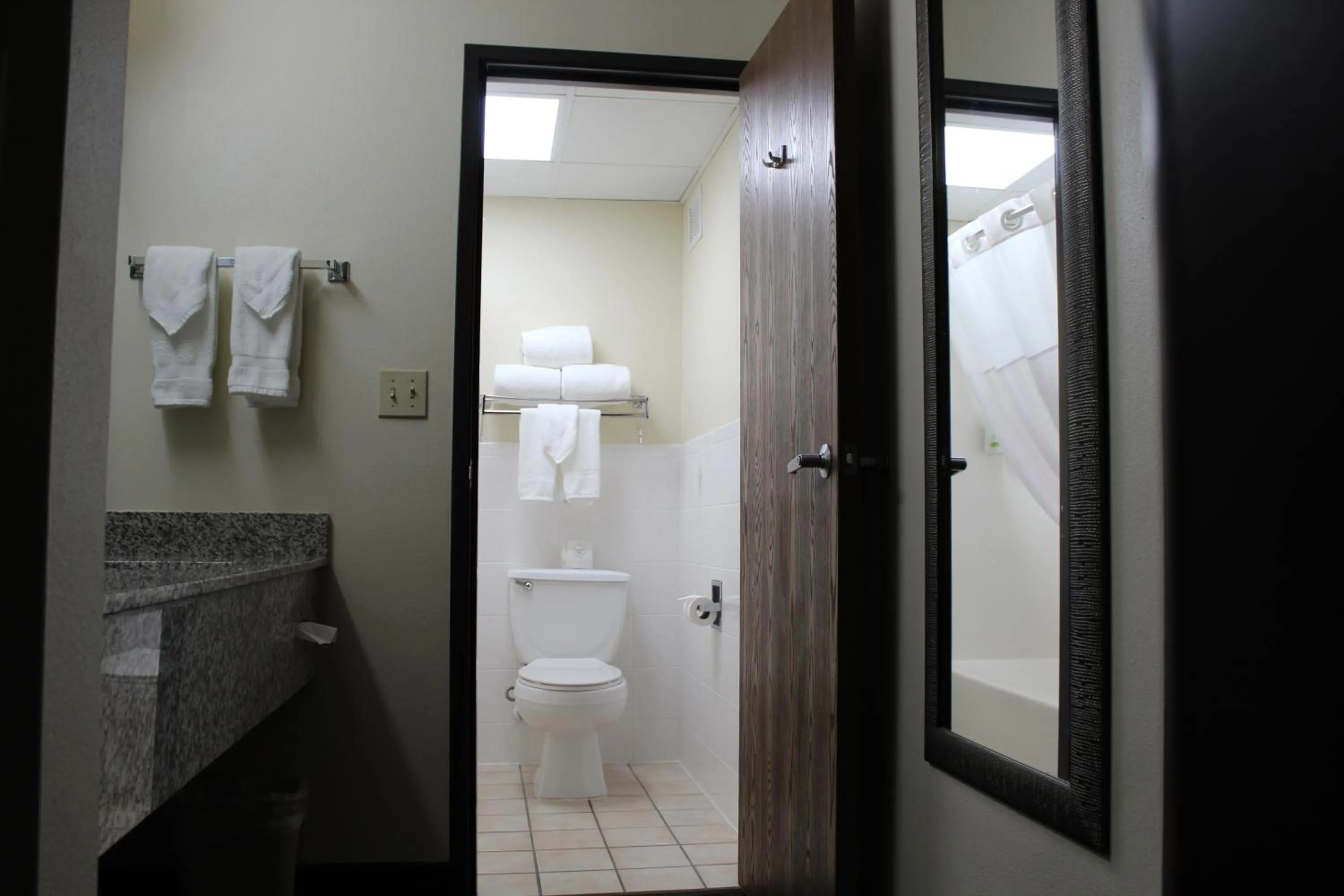 Toilet in AmericInn by Wyndham Windsor Ft. Collins