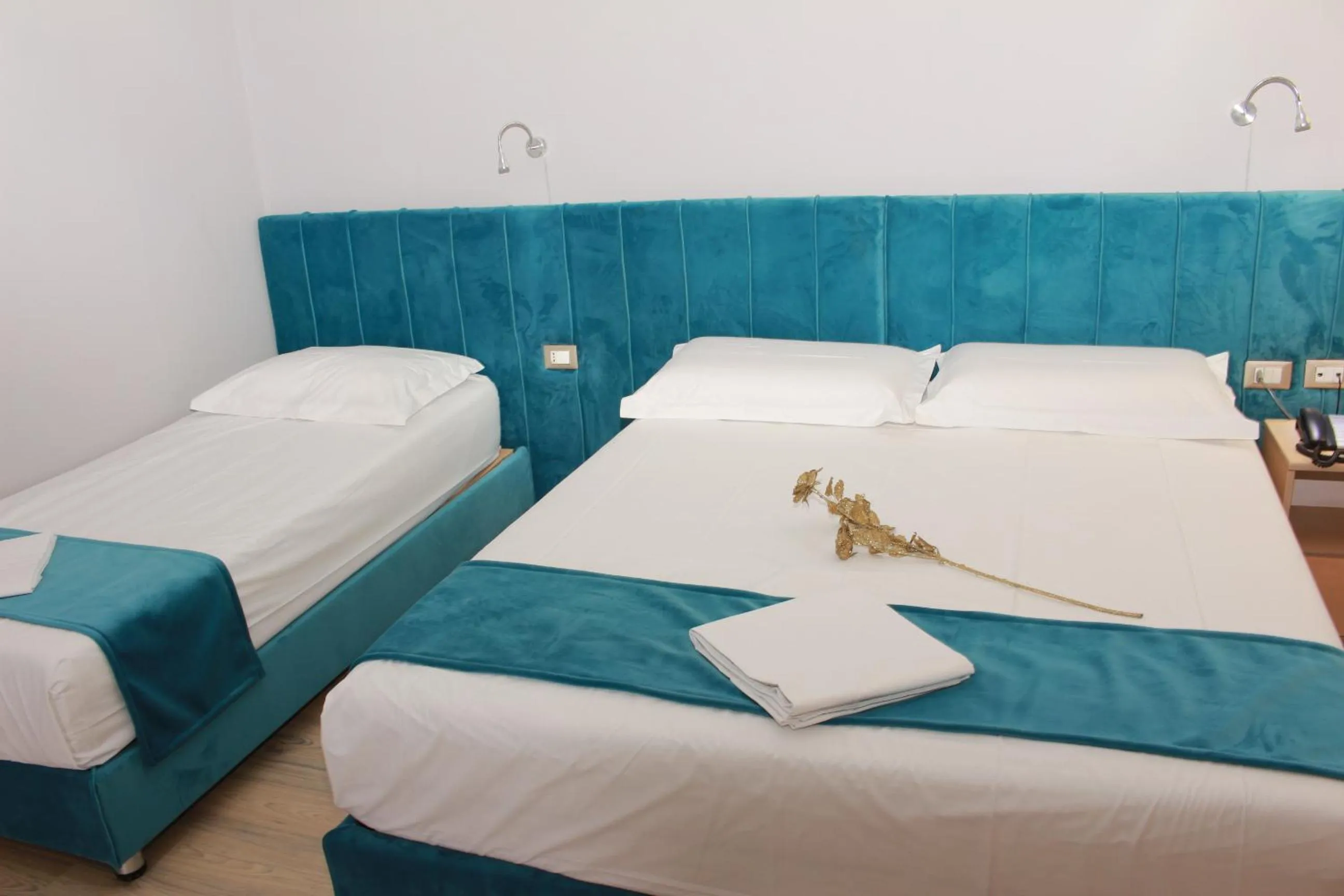 Bed in Theranda Boutique Hotel