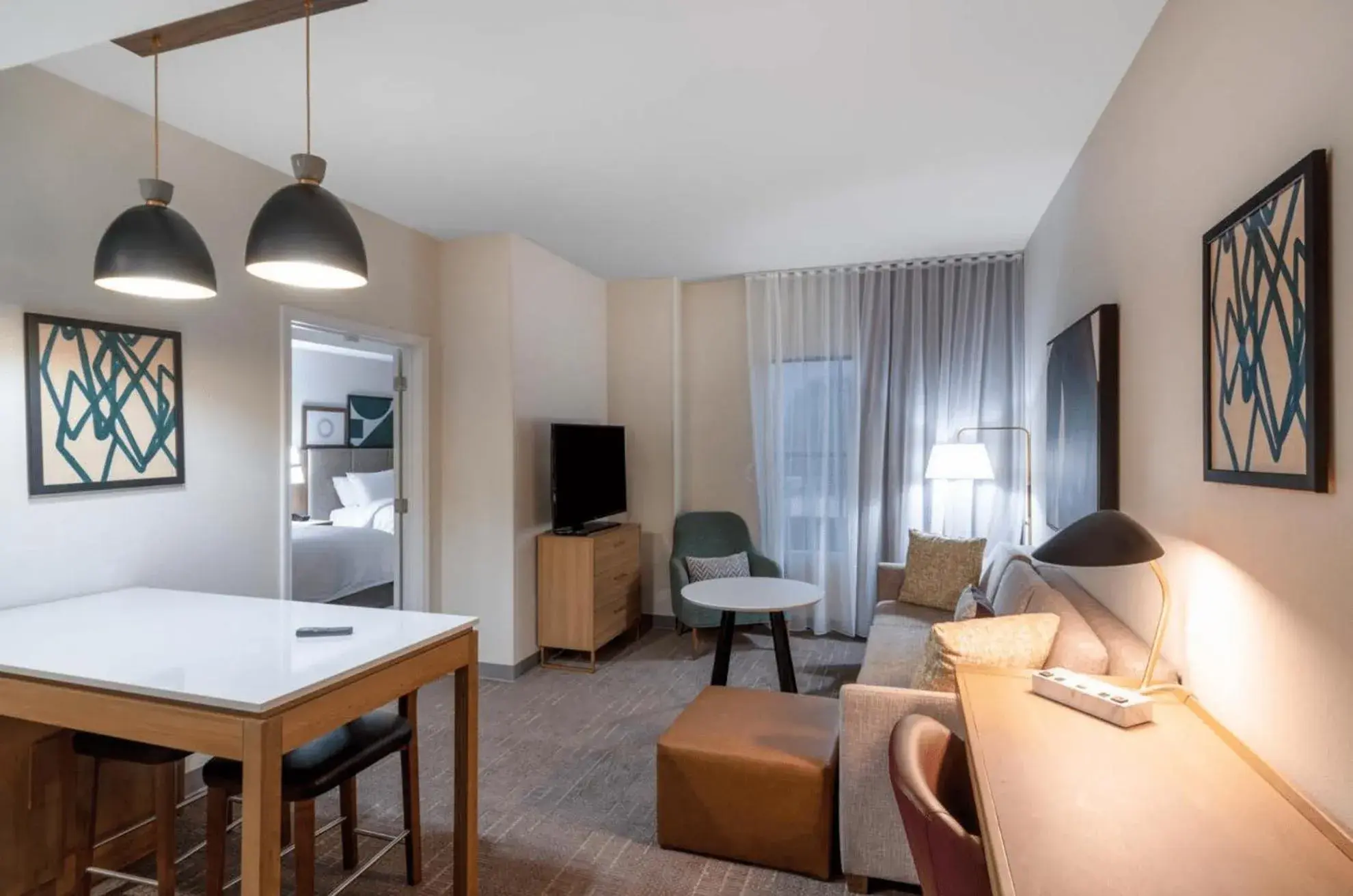 Living room, Bed in Staybridge Suites - Flowood - NW Jackson by IHG Living room, Bed in Staybridge Suites - Flowood - NW Jackson by IHG