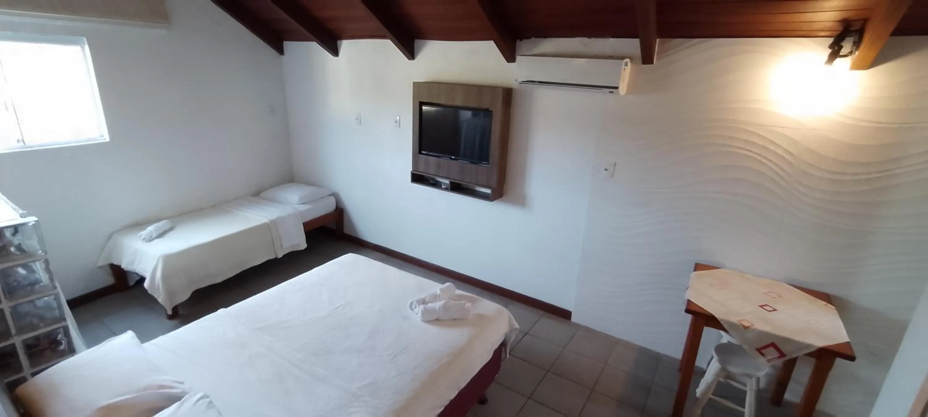 Bed in Residencial da Praça Garopaba