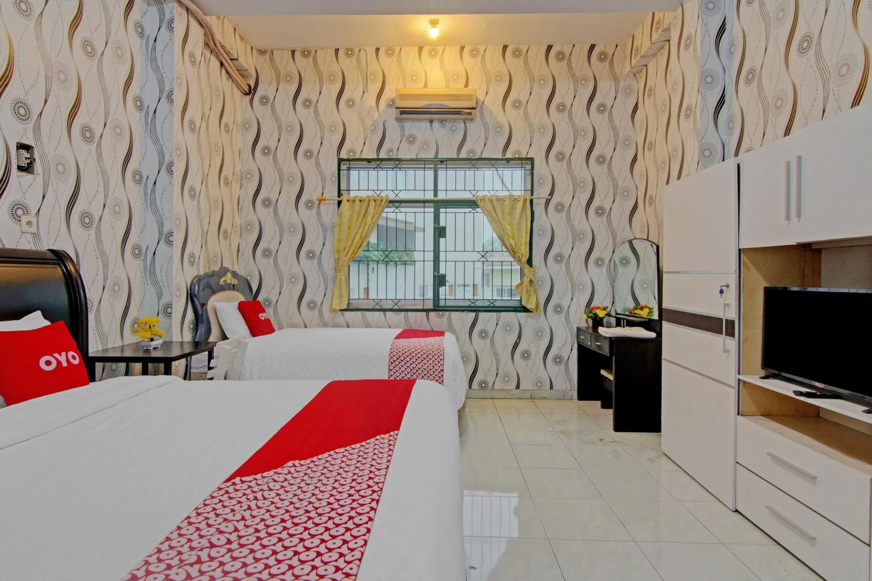 Bedroom in OYO 90615 Jojo Homestay