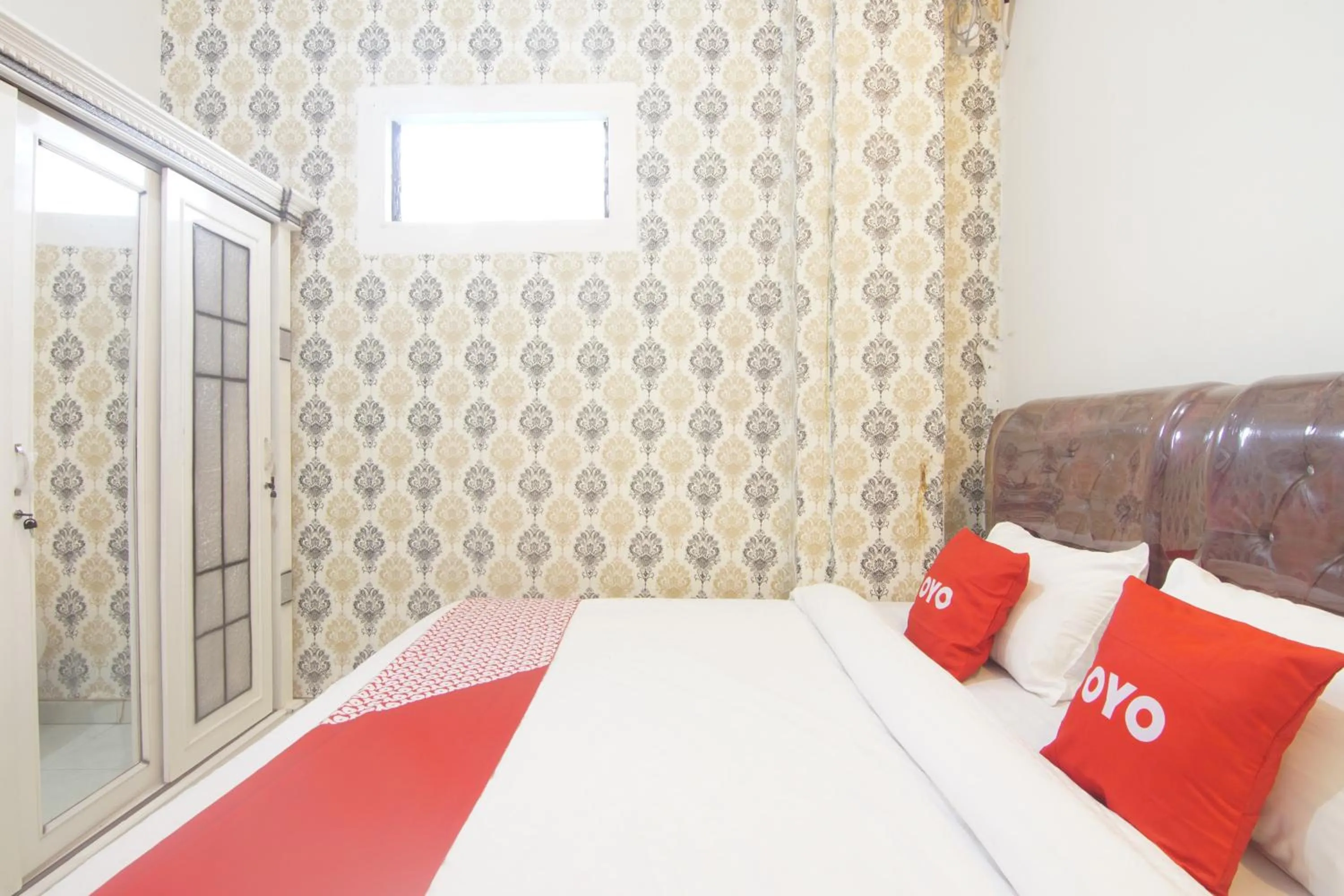 Bedroom in OYO 90615 Jojo Homestay