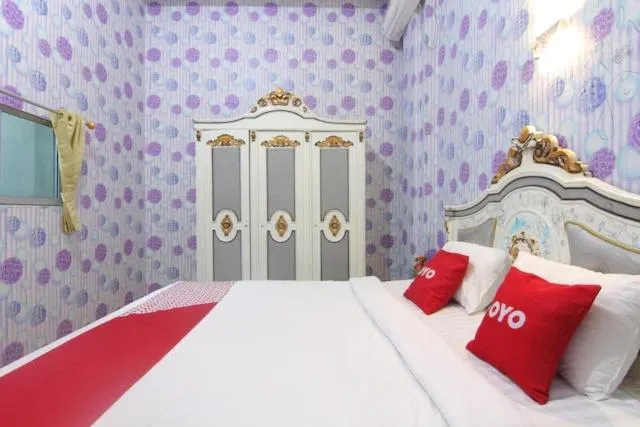 Bedroom in OYO 90615 Jojo Homestay