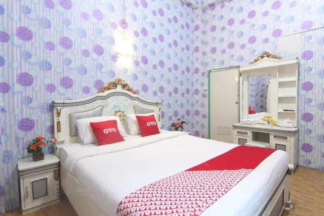 Bedroom in OYO 90615 Jojo Homestay