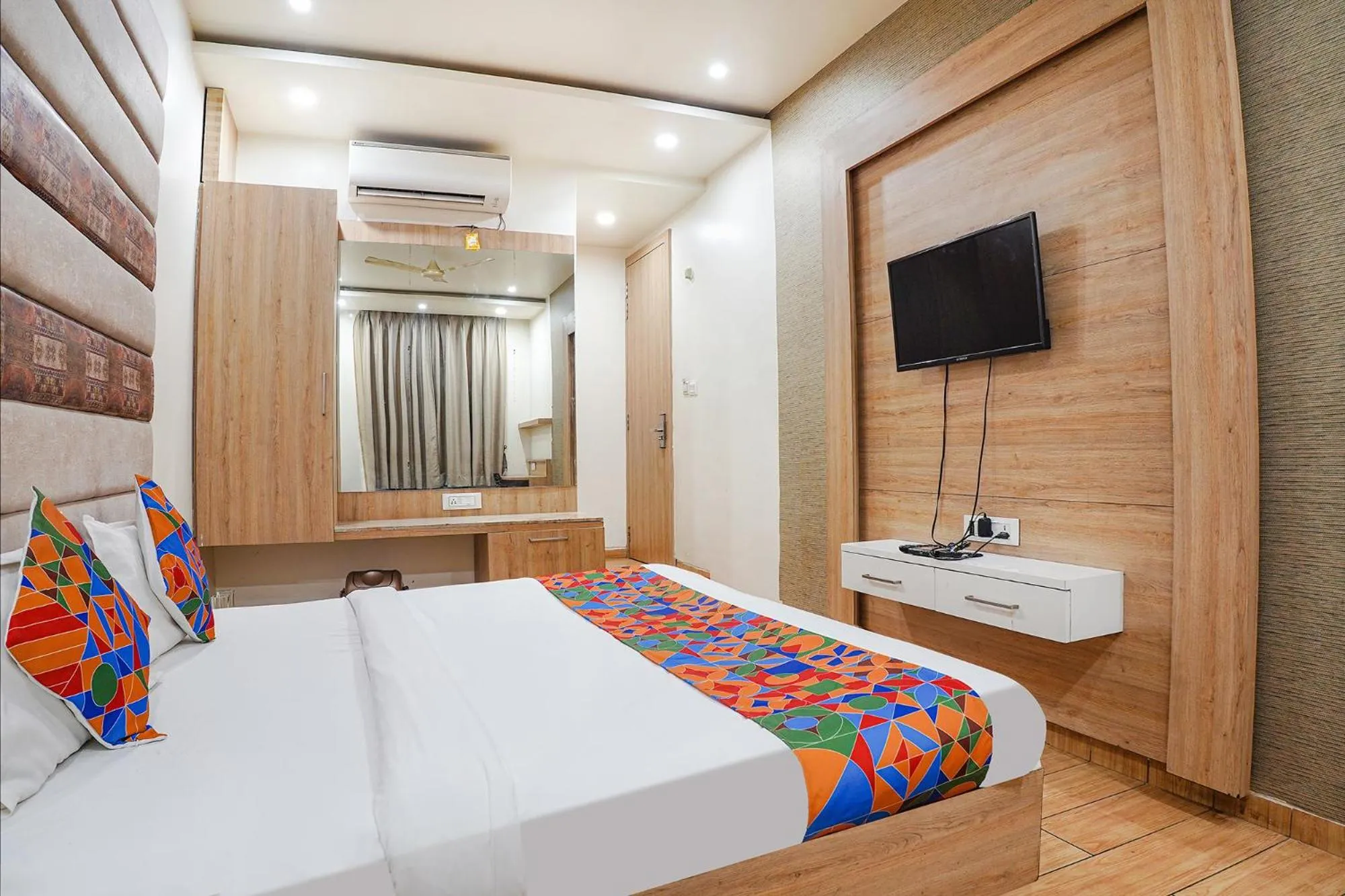 Bed in FabHotel Prime OM Palace