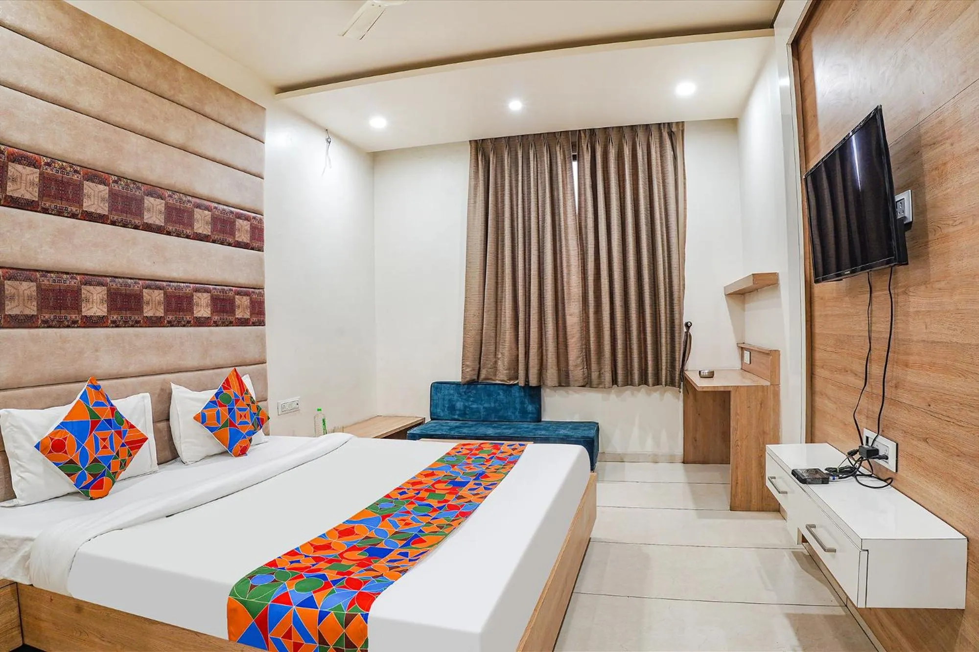 Bed in FabHotel Prime OM Palace