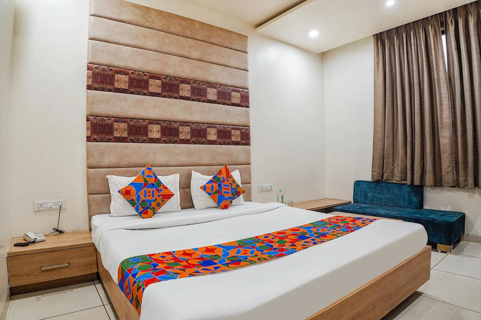 Bed in FabHotel Prime OM Palace