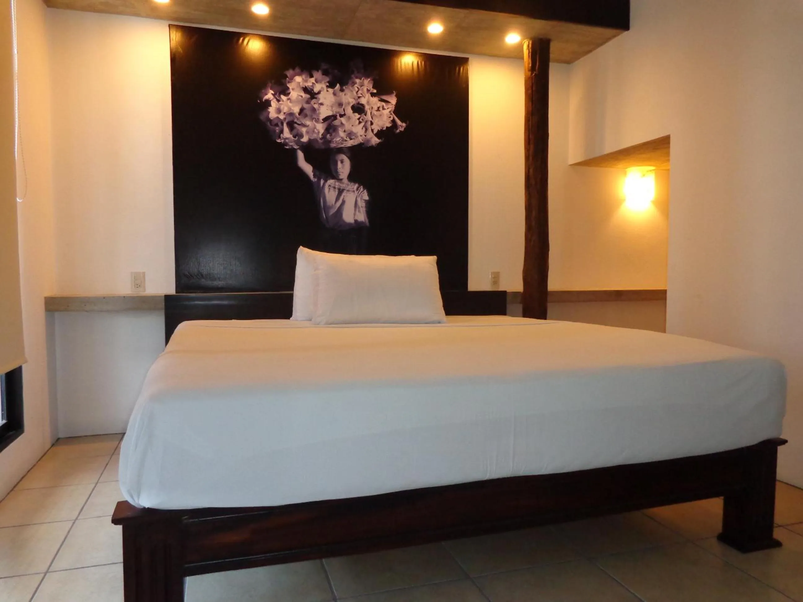 Bed in Hotel Maya Rue