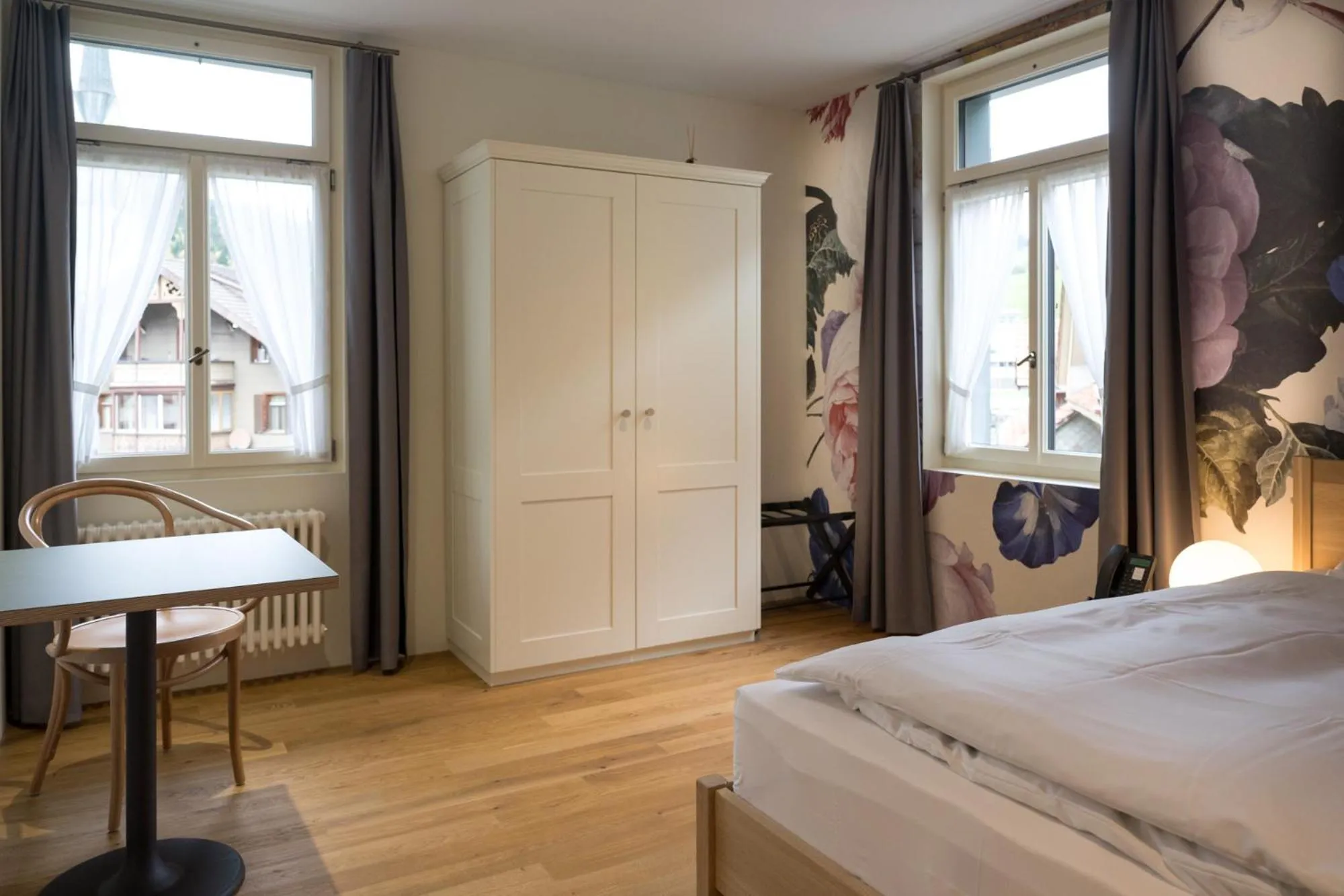 Photo of the whole room, Bed in FLÜHLI Hotel Kurhaus