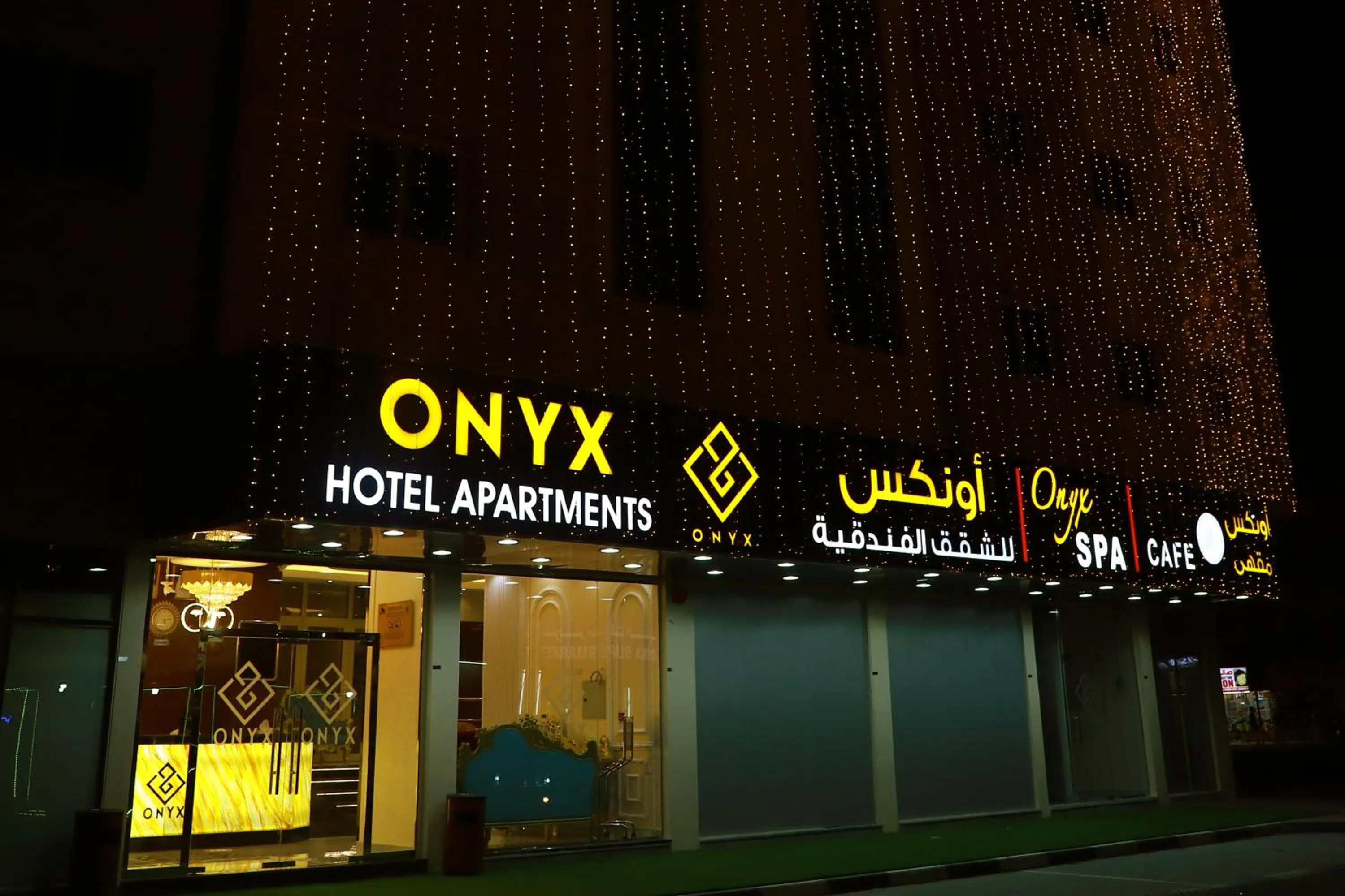 Property logo or sign in Onyx Hotel Apartments - MAHA HOSPITALITY GROUP