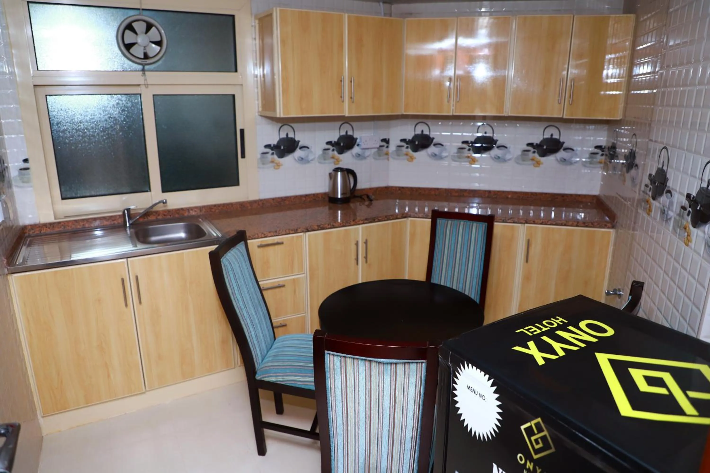 Kitchen or kitchenette in Onyx Hotel Apartments - MAHA HOSPITALITY GROUP