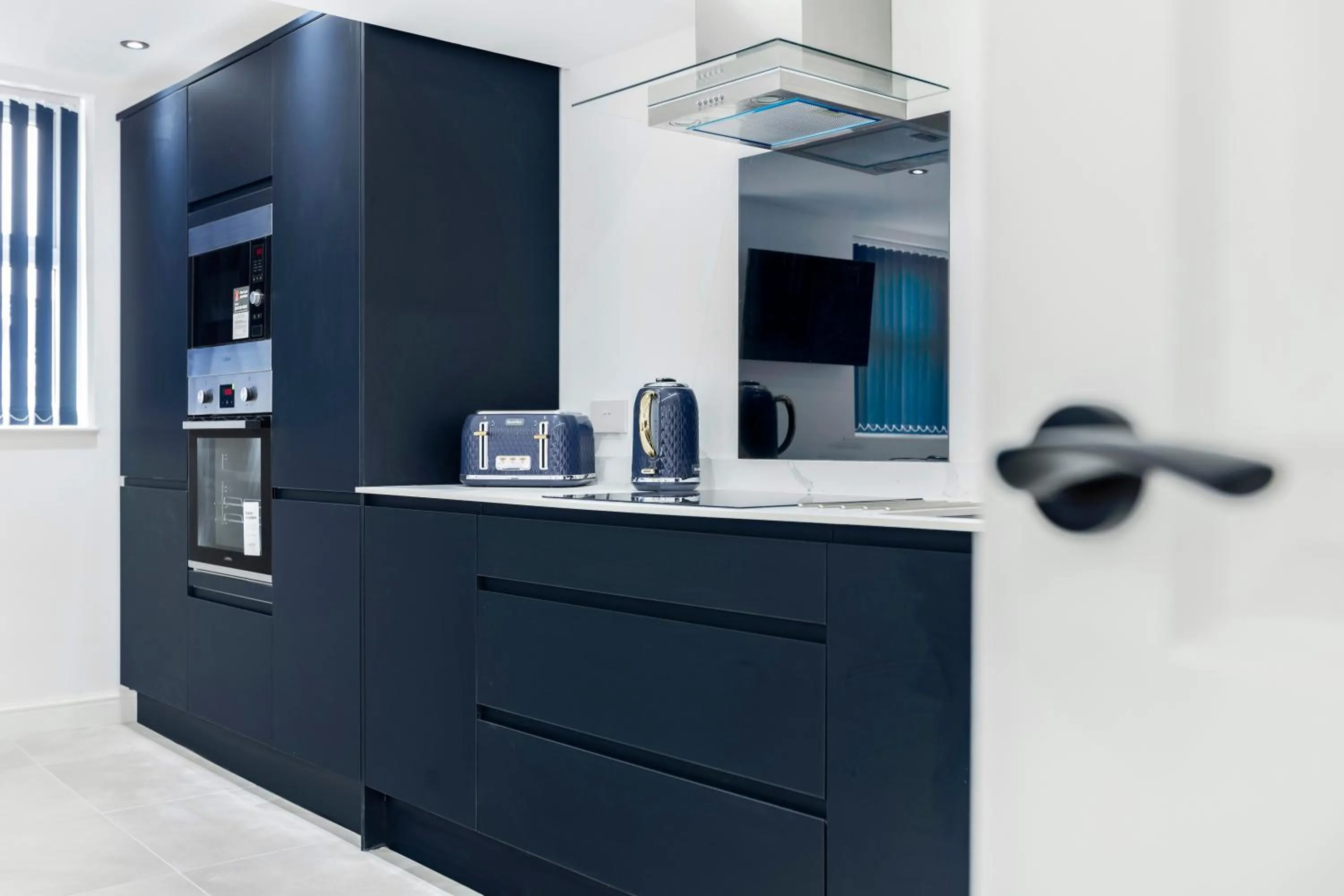 Kitchen or kitchenette in Wellington Suites by Sasco Apartments