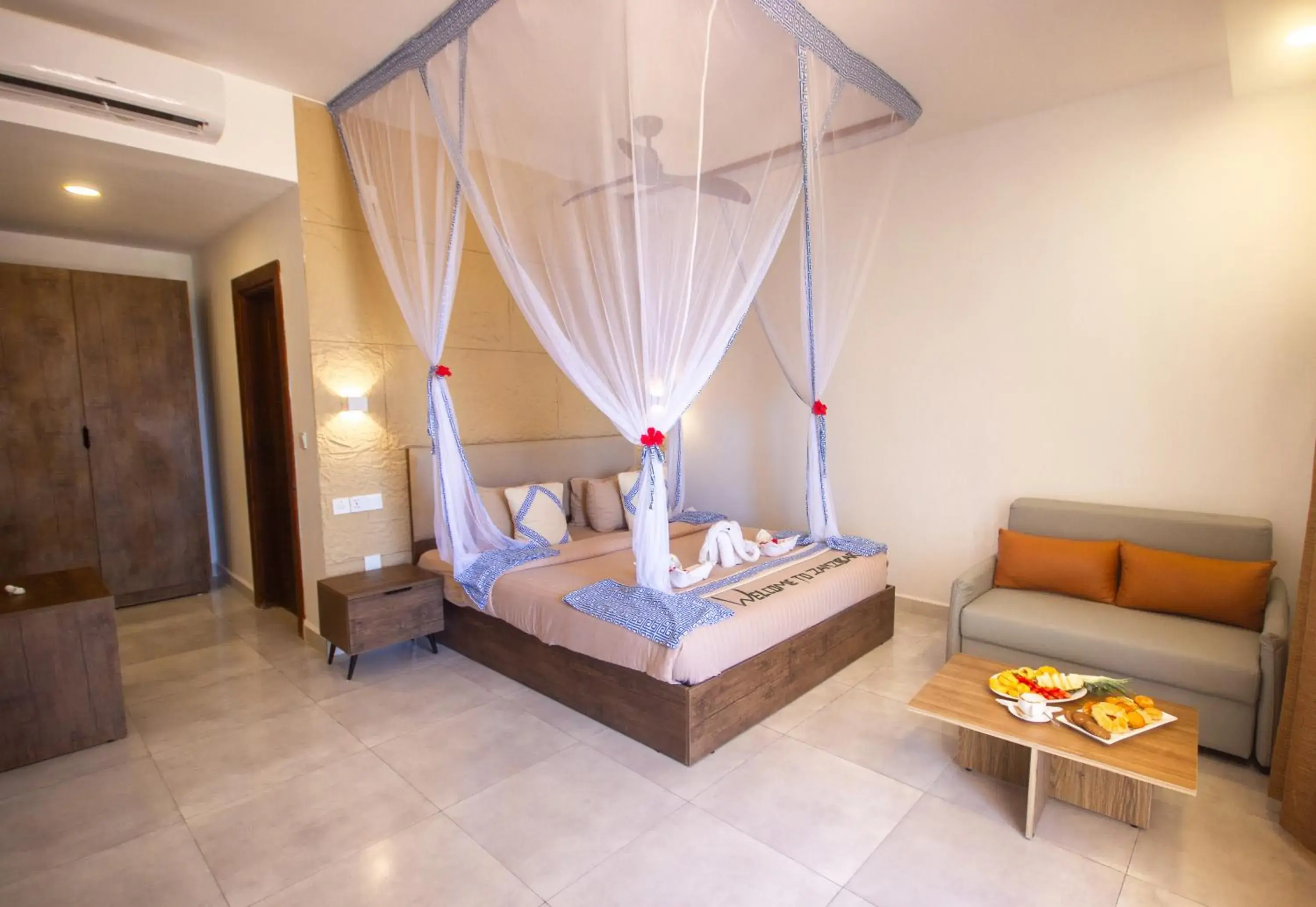 Bed in Reef & Beach Resort - Spa Jambiani Bed in Reef & Beach Resort - Spa Jambiani