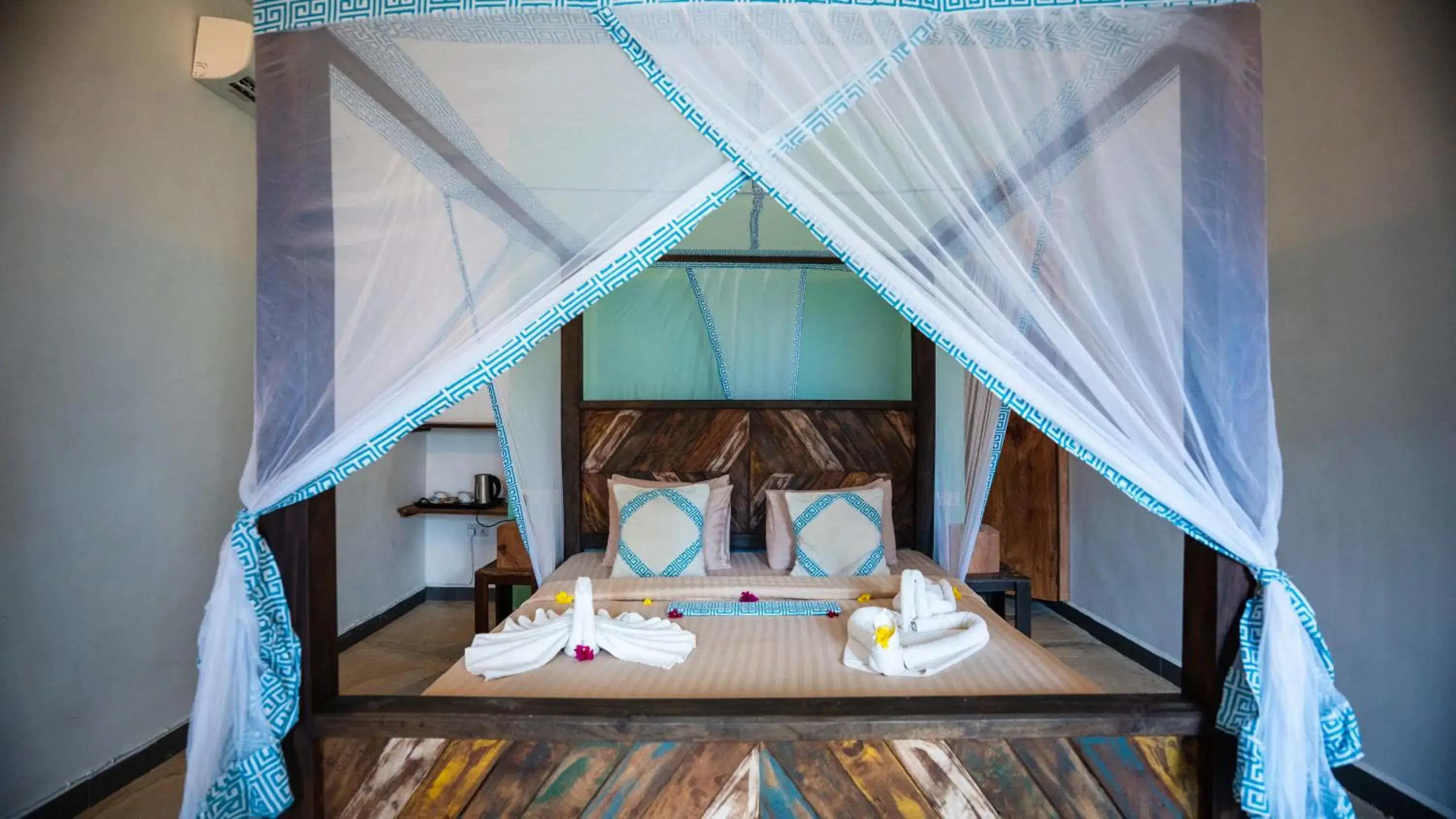 Bed in Reef & Beach Resort - Spa Jambiani Bed in Reef & Beach Resort - Spa Jambiani