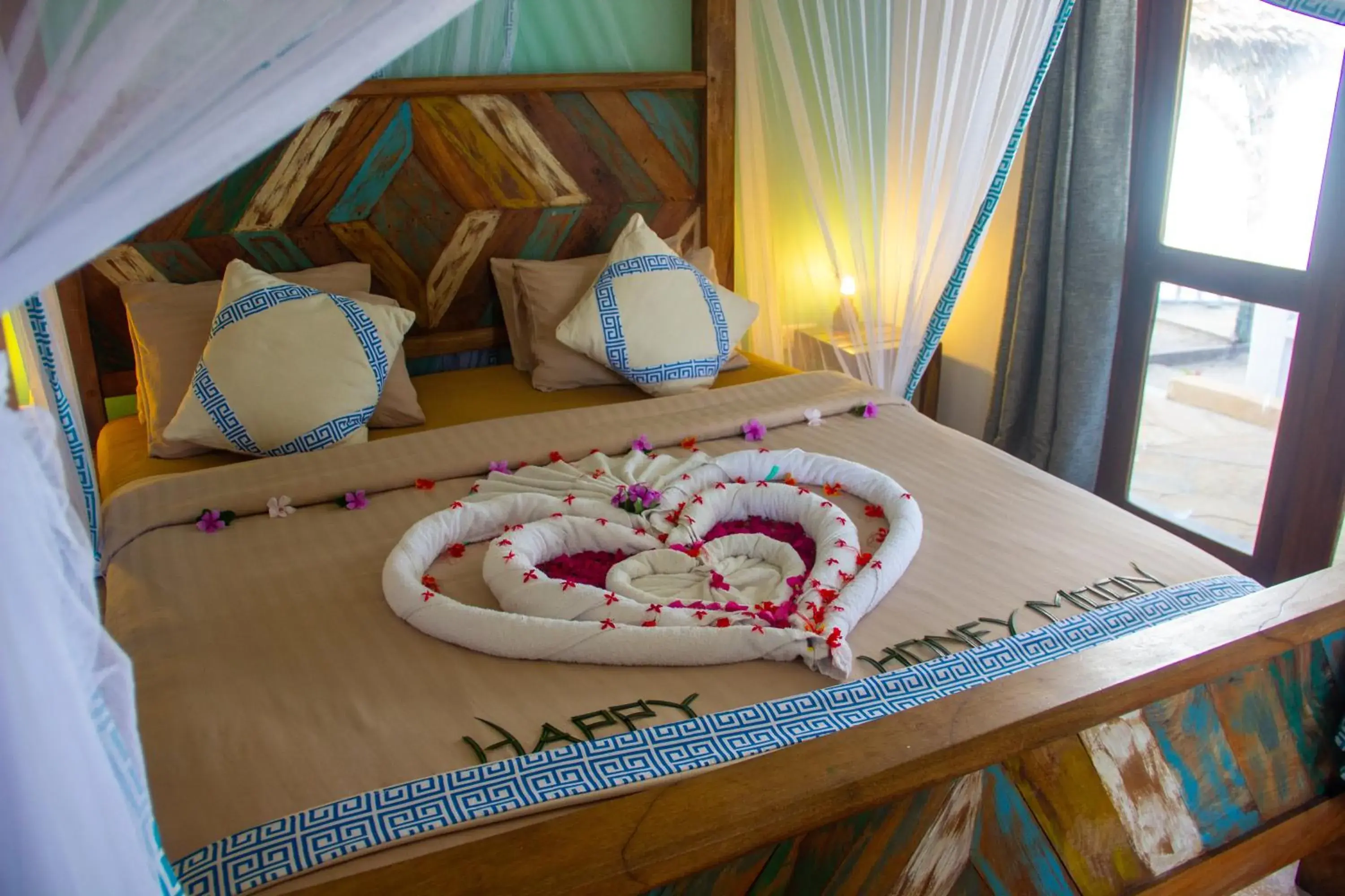 Bed in Reef & Beach Resort - Spa Jambiani Bed in Reef & Beach Resort - Spa Jambiani