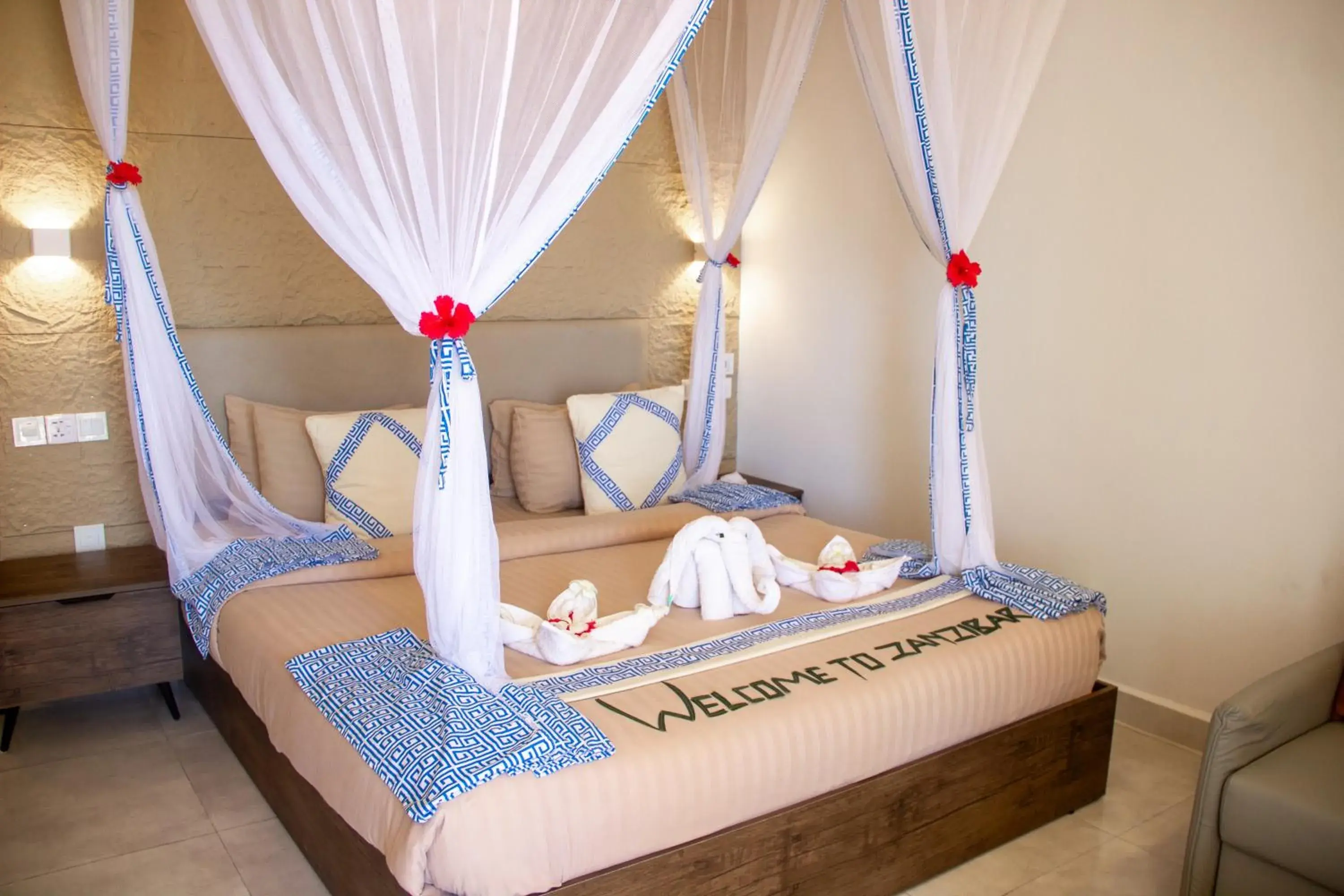 Bed in Reef & Beach Resort - Spa Jambiani Bed in Reef & Beach Resort - Spa Jambiani