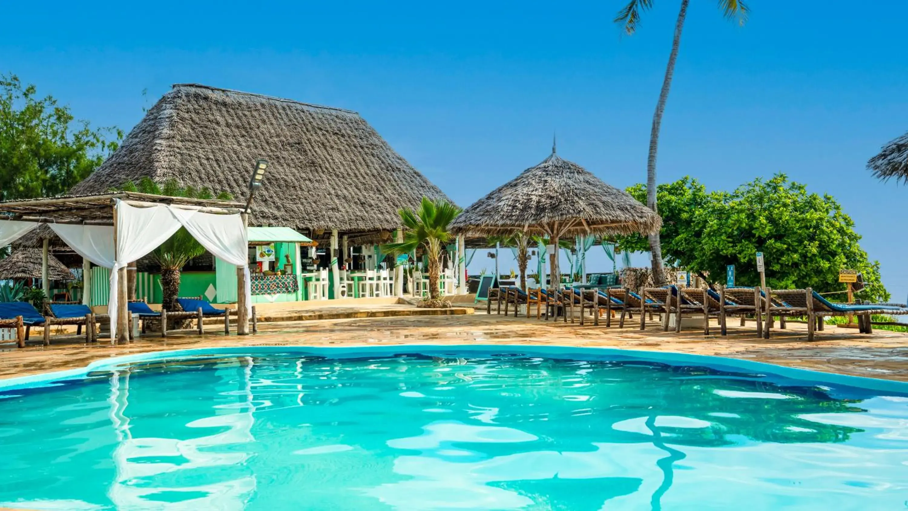 Swimming pool in Reef & Beach Resort - Spa Jambiani Swimming pool in Reef & Beach Resort - Spa Jambiani