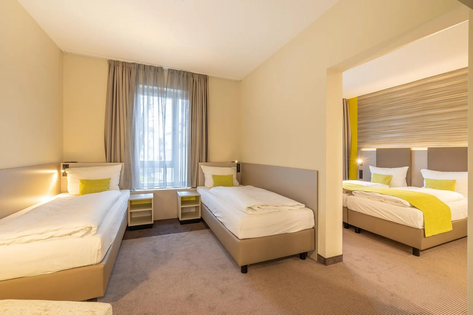 Photo of the whole room, Bed in th Hotel Leipzig Messe