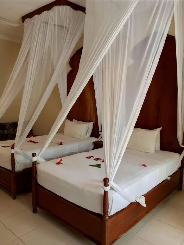 Bed in Sunset Kendwa Beach Hotel