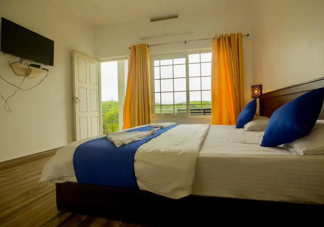 Bed in White Stone Vagamon Hilltop Cottage by VOYE HOMES Bed in White Stone Vagamon Hilltop Cottage by VOYE HOMES