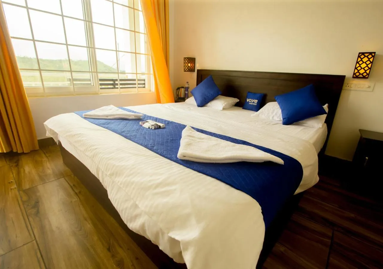 Bed in White Stone Vagamon Hilltop Cottage by VOYE HOMES