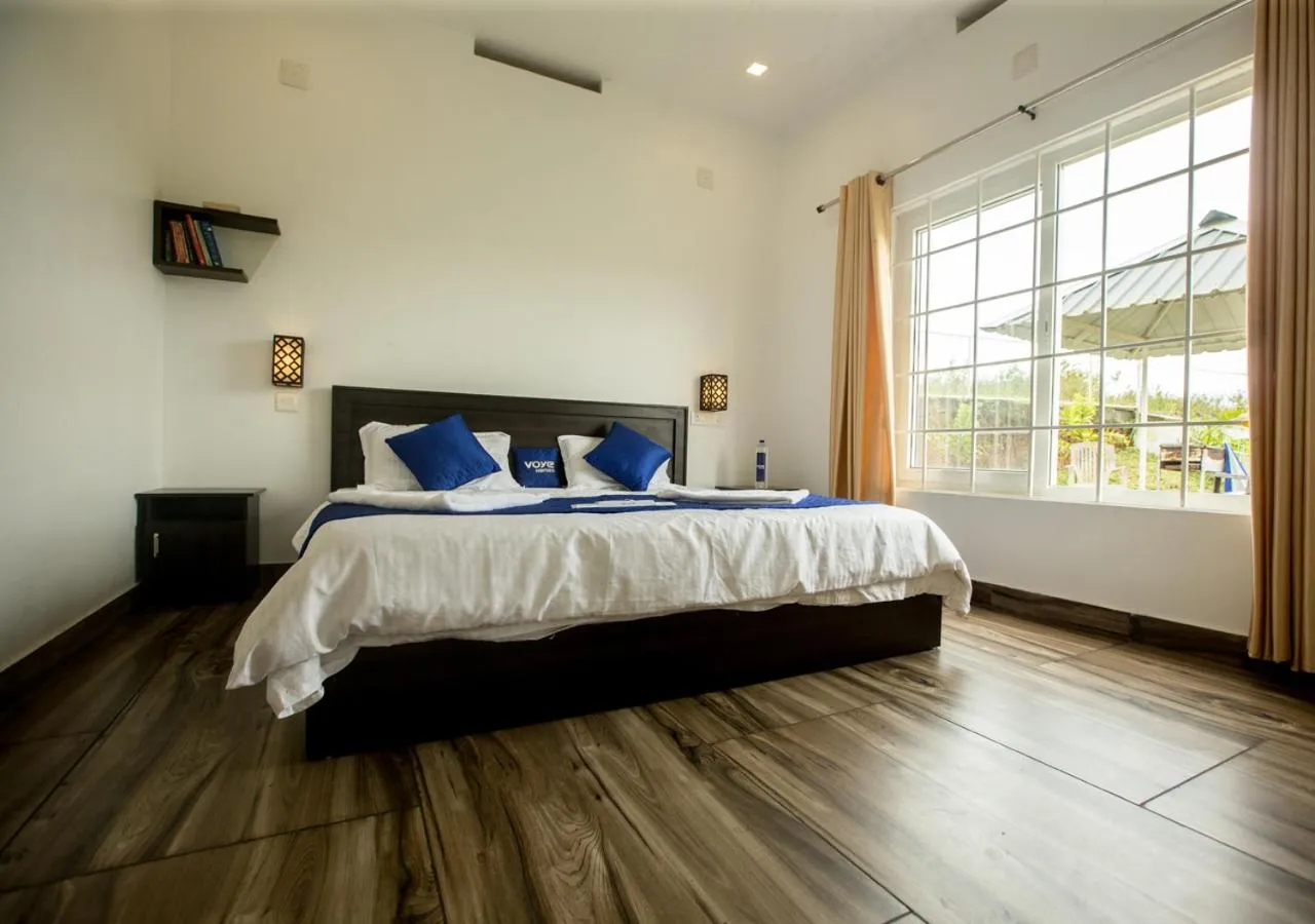 Bed in White Stone Vagamon Hilltop Cottage by VOYE HOMES