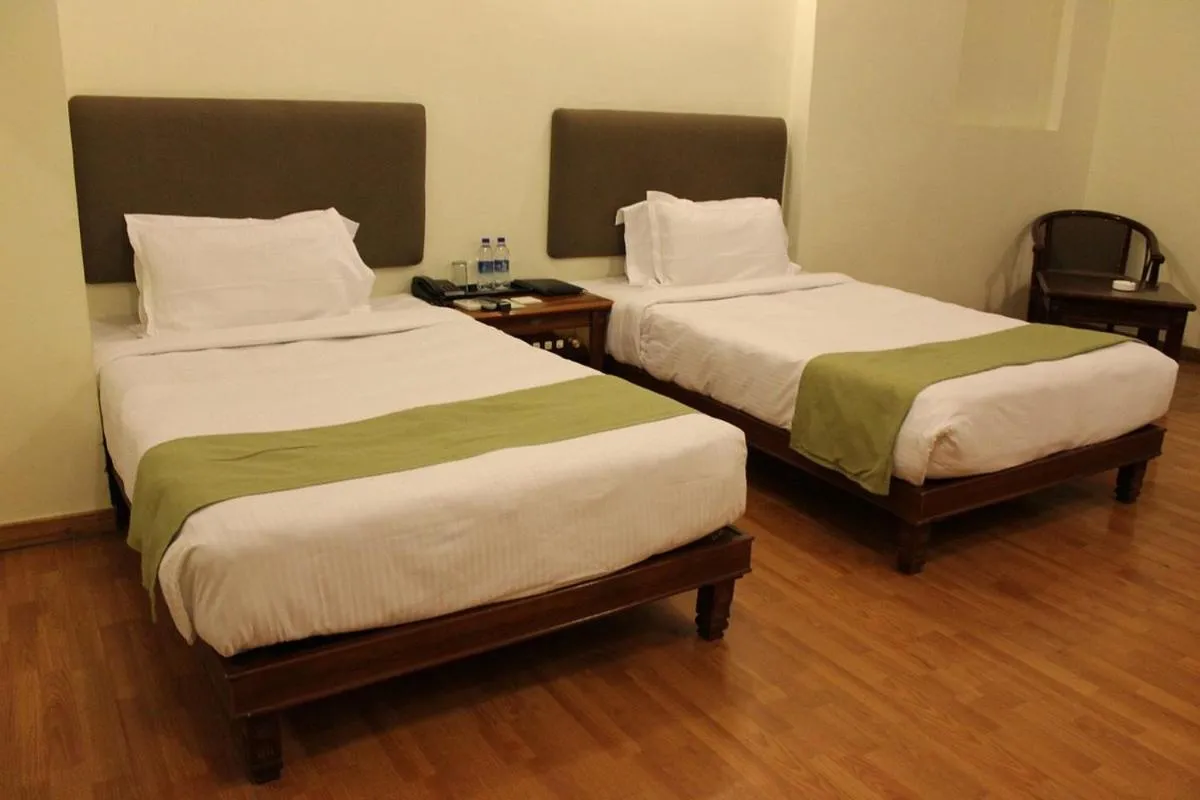 Bed in THE CENT HOTEL