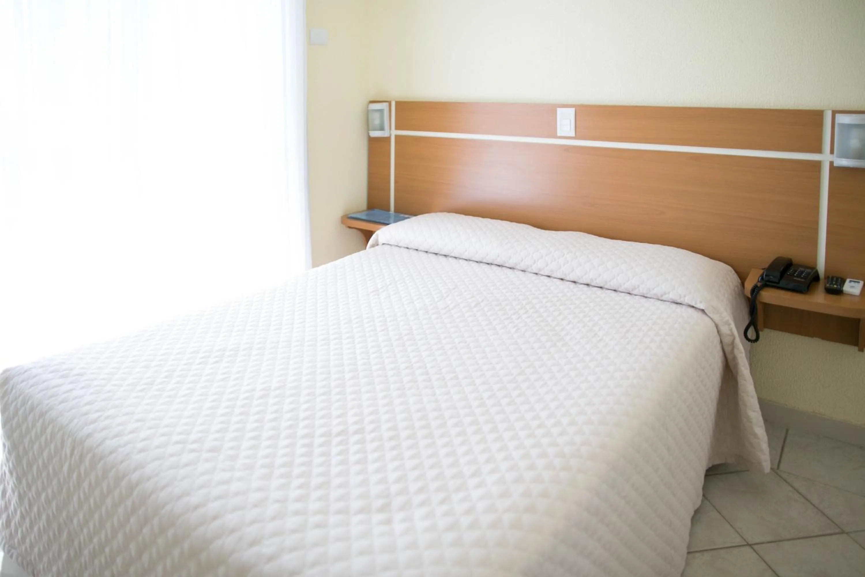 Bed in Bombinhas Praia Apart Hotel - Unidade rua Corrupião