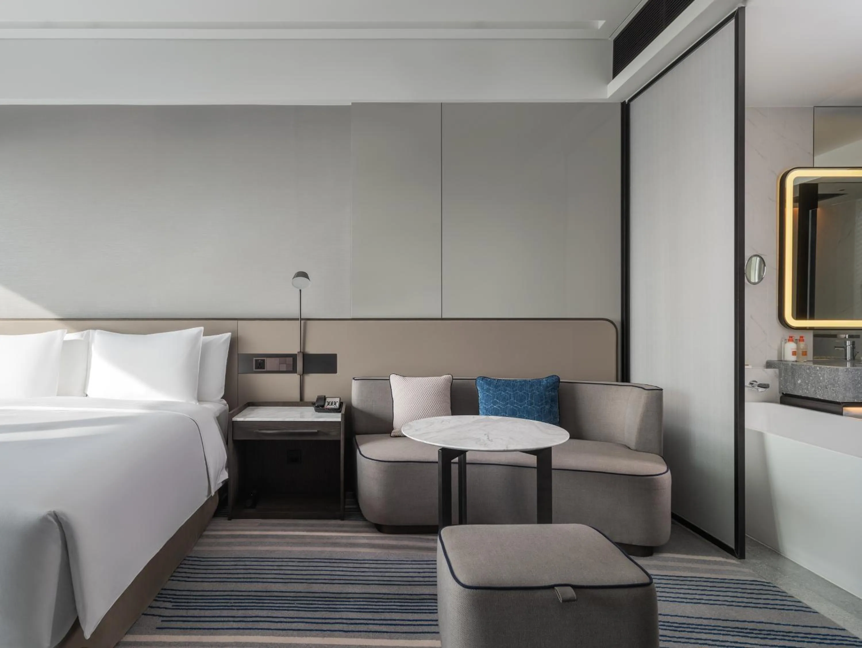 Seating area, Bed in Crowne Plaza Xiamen Jimei Seaview by IHG-Free Mini Bar