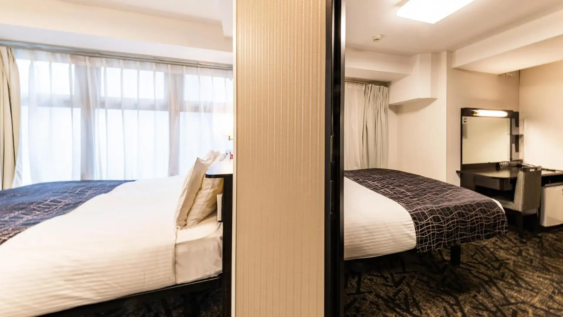 Bed in APA Hotel Nambaminami Daikokucho Ekimae Bed in APA Hotel Nambaminami Daikokucho Ekimae