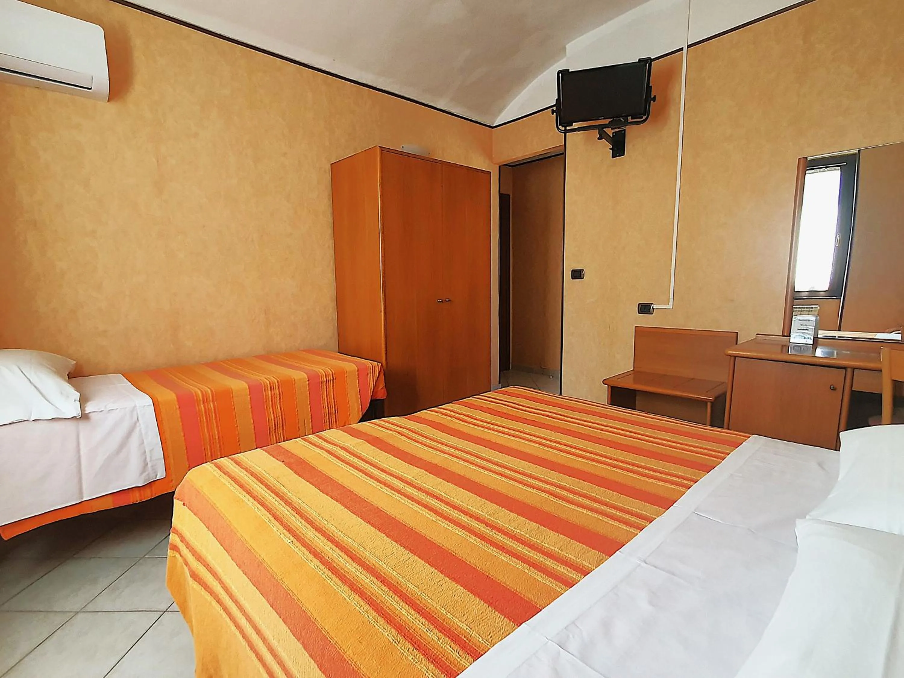 Bed in Hotel Isolabella