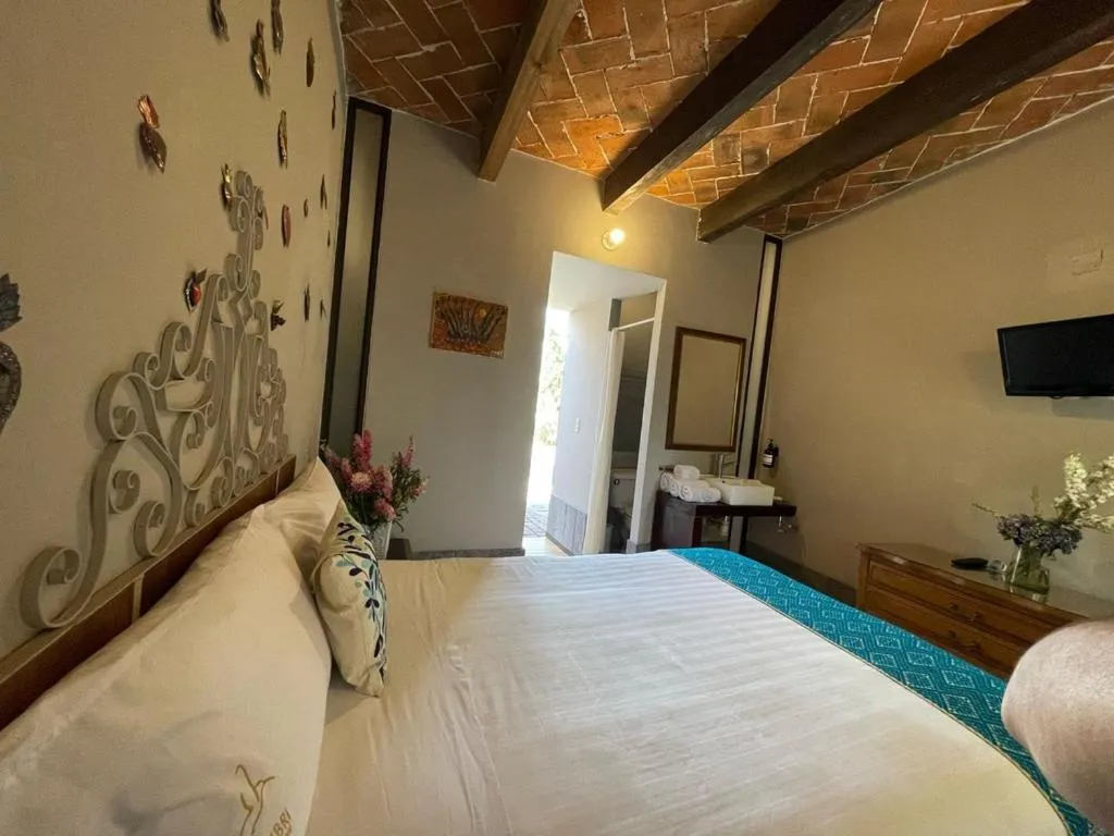 Bed in Posada Colibri - Hotel & Spa