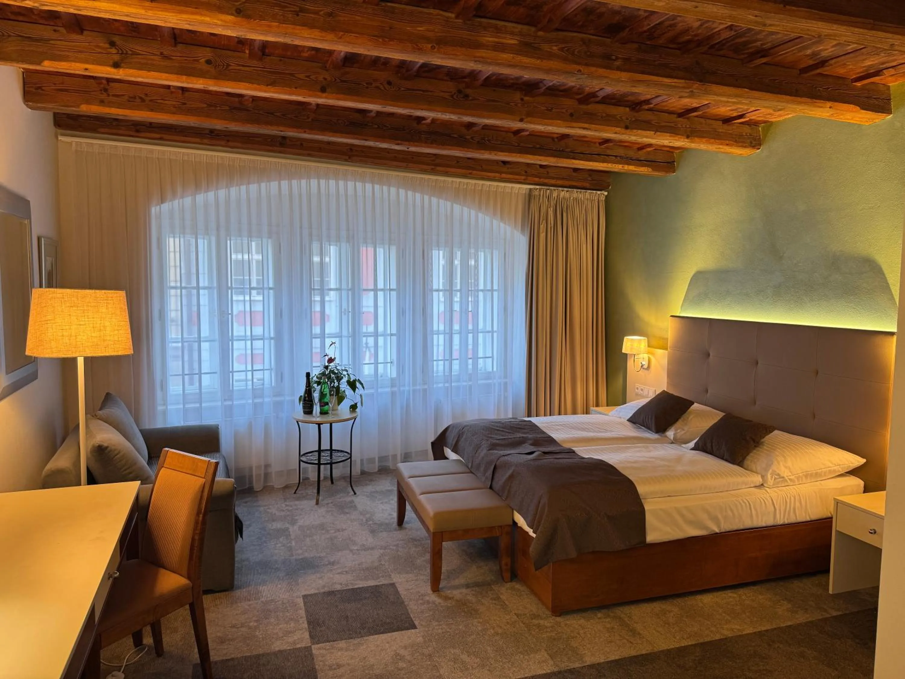 Bed in The Golden Wheel Hotel