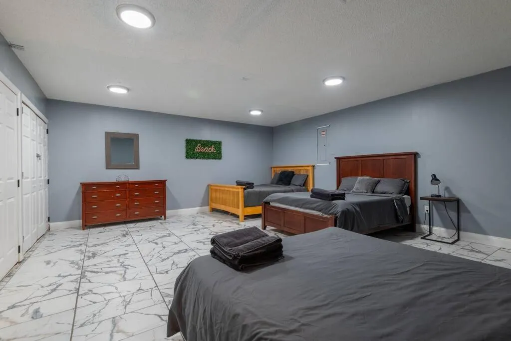 Bed in Tropical Escape with Relaxing Heated Pool & Palm Breezes