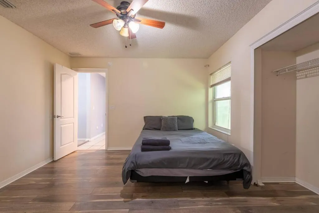 Bed in Tropical Escape with Relaxing Heated Pool & Palm Breezes