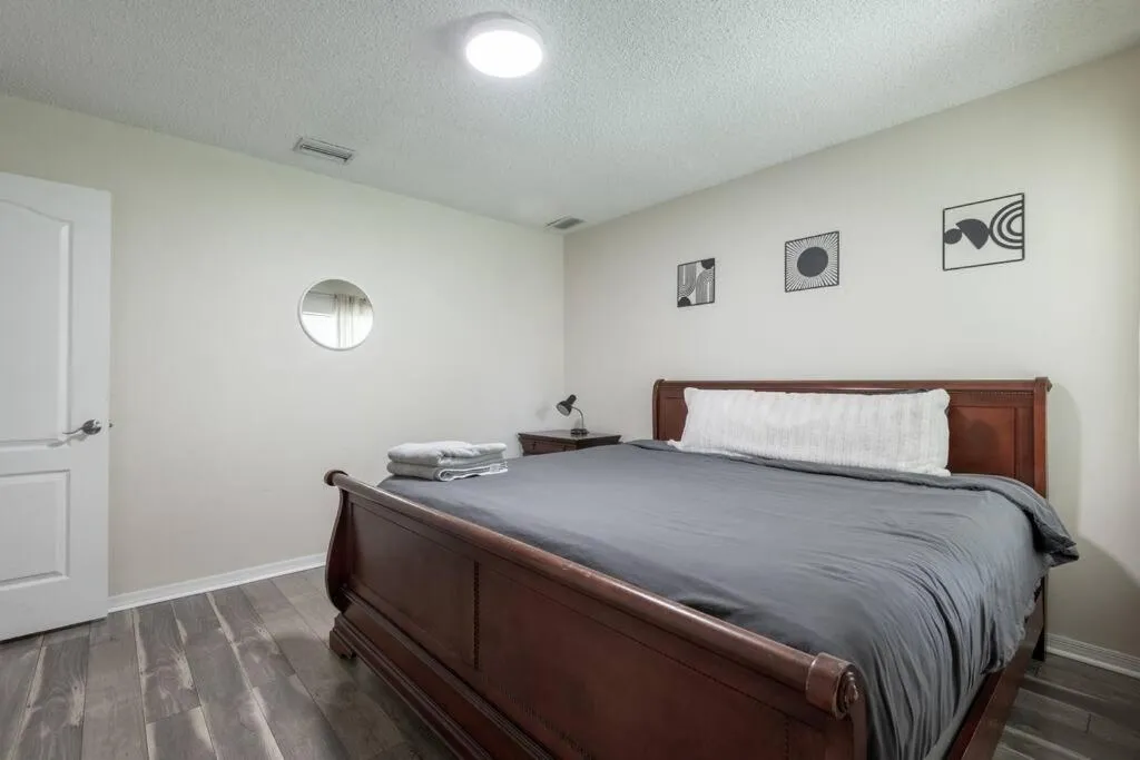 Bed in Tropical Escape with Relaxing Heated Pool & Palm Breezes