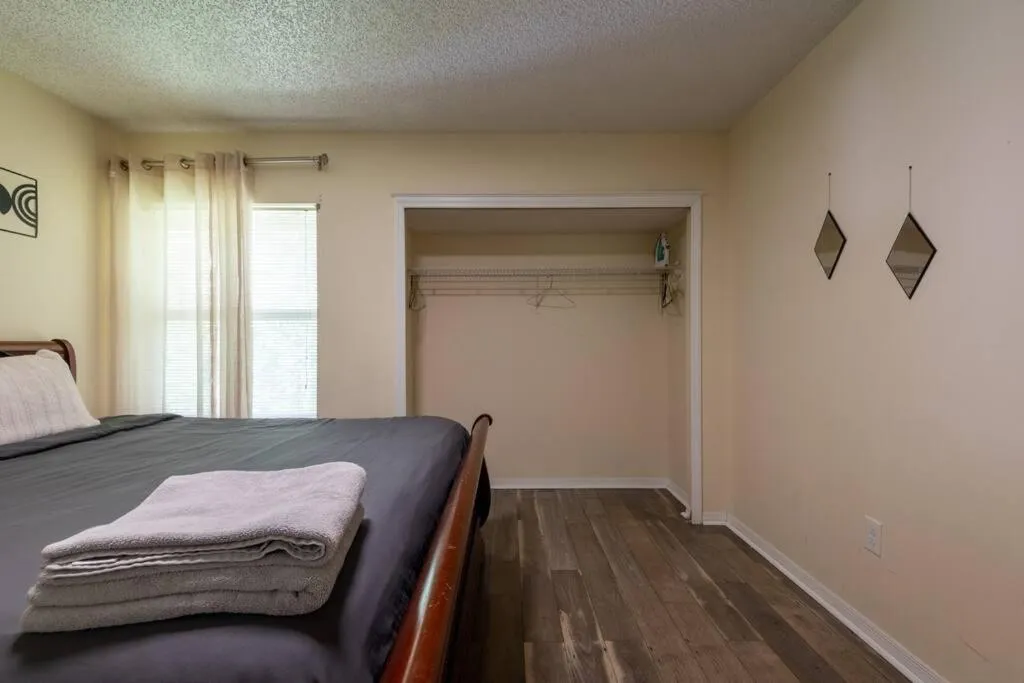 Bed in Tropical Escape with Relaxing Heated Pool & Palm Breezes