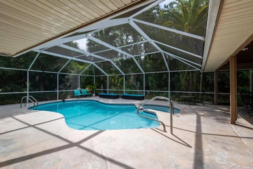 Swimming pool in Tropical Escape with Relaxing Heated Pool & Palm Breezes