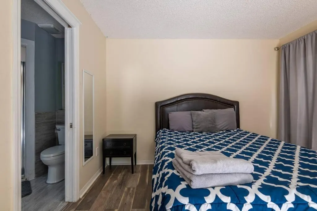 Bed in Tropical Escape with Relaxing Heated Pool & Palm Breezes