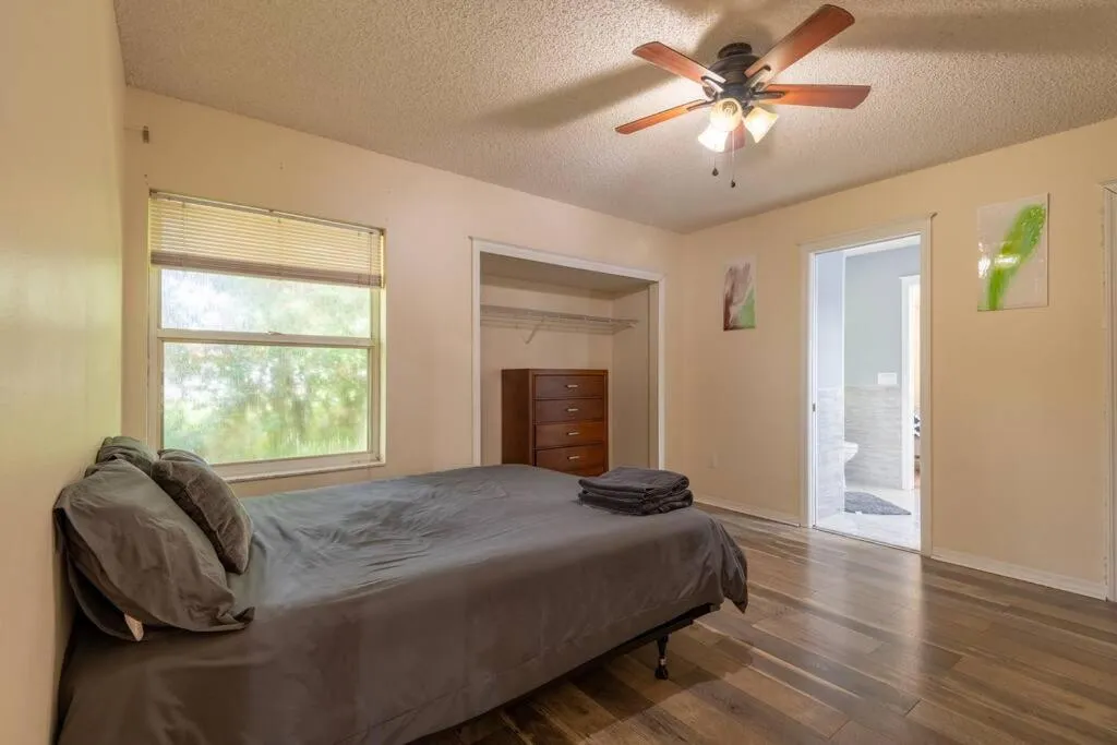 Bed in Tropical Escape with Relaxing Heated Pool & Palm Breezes