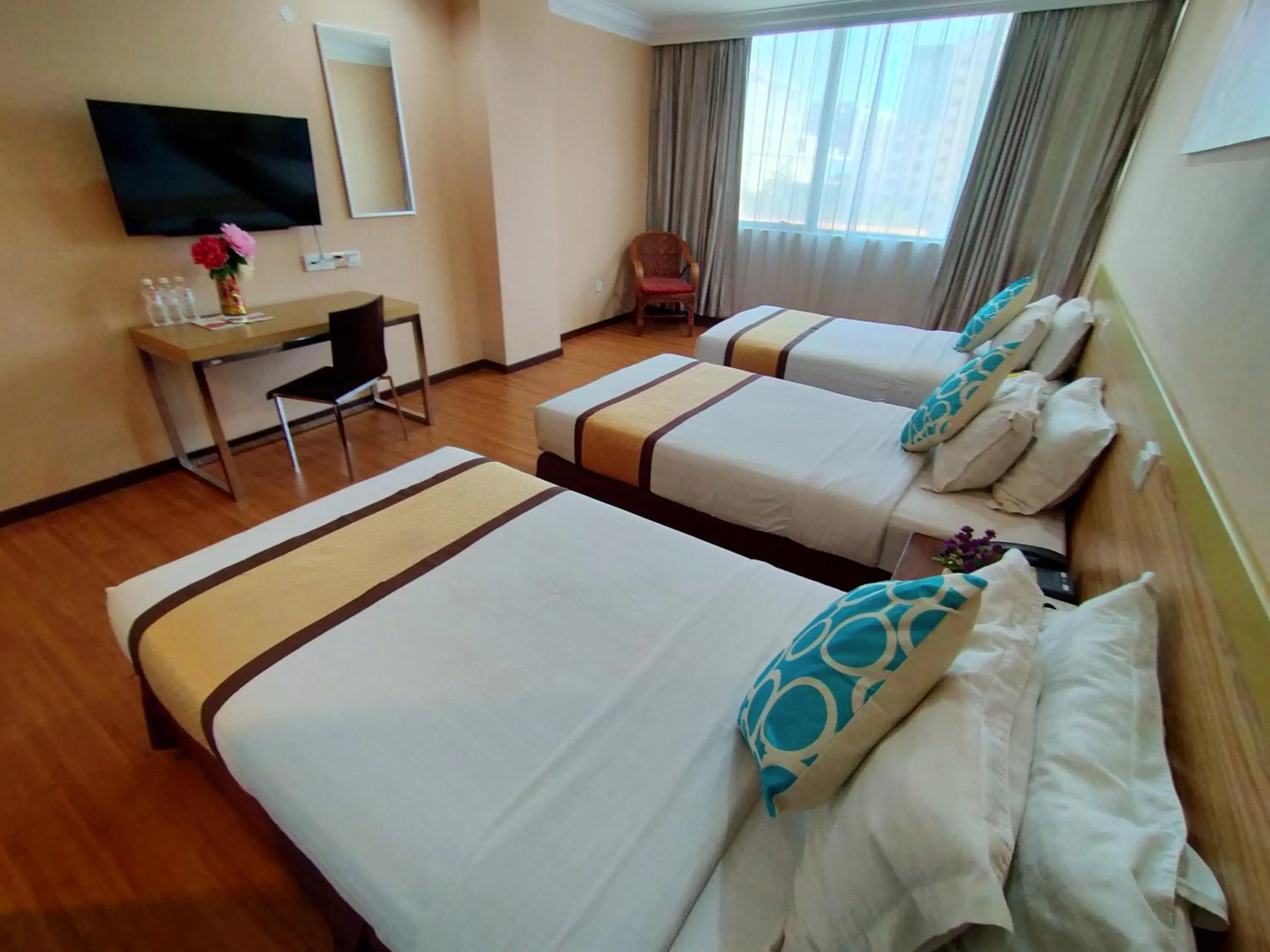 Bed in TD Plaza Hotel